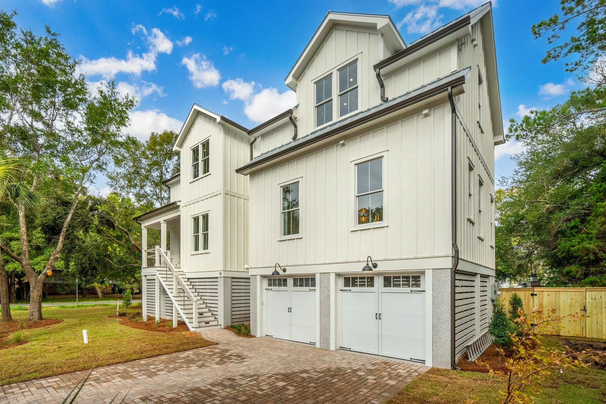 Side elevation with drive-under garages on a custom Isle of Palms SC coastal home build