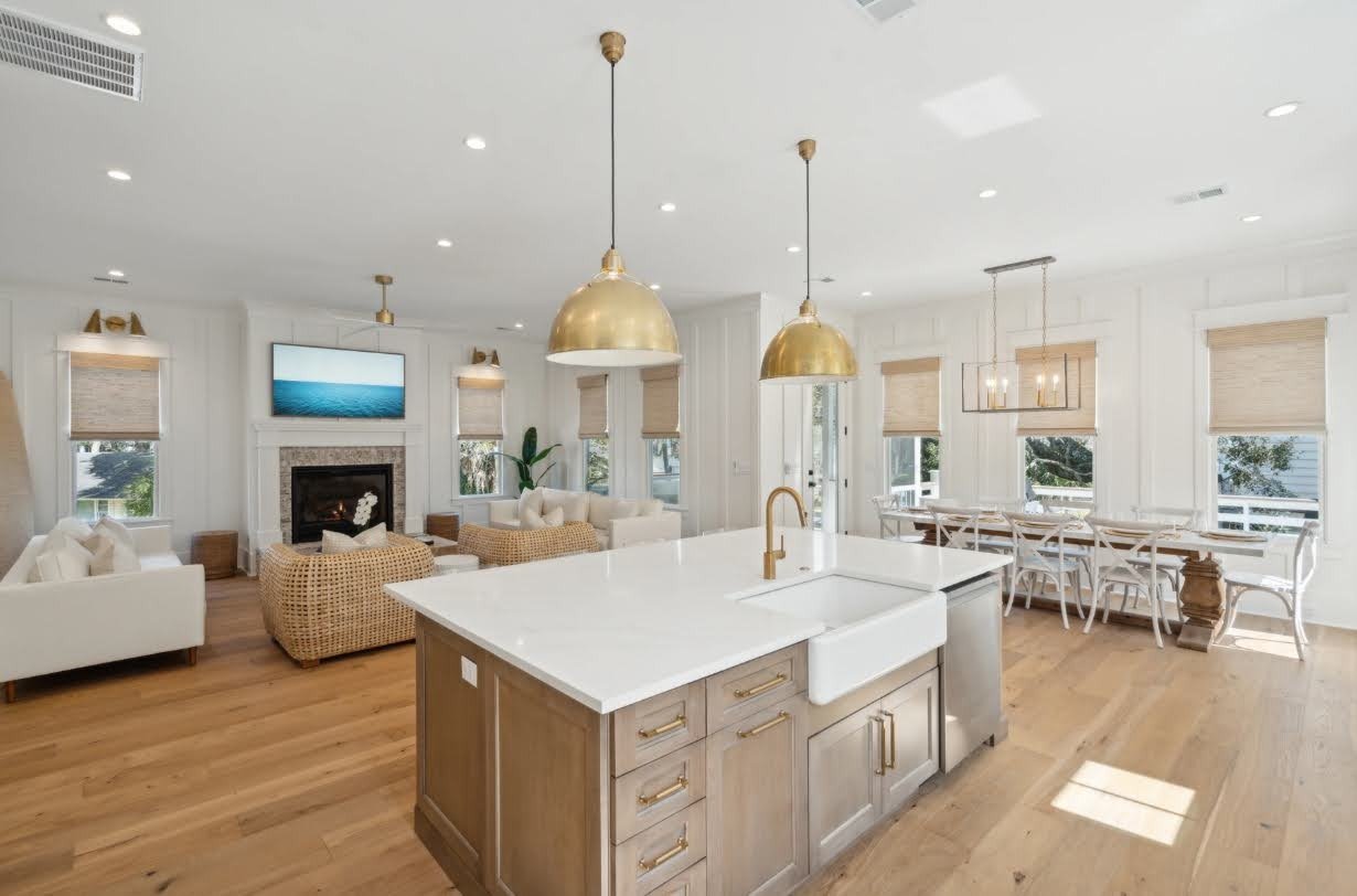 Open-concept kitchen and family room in an Isle of Palms SC home by Iconic Developments