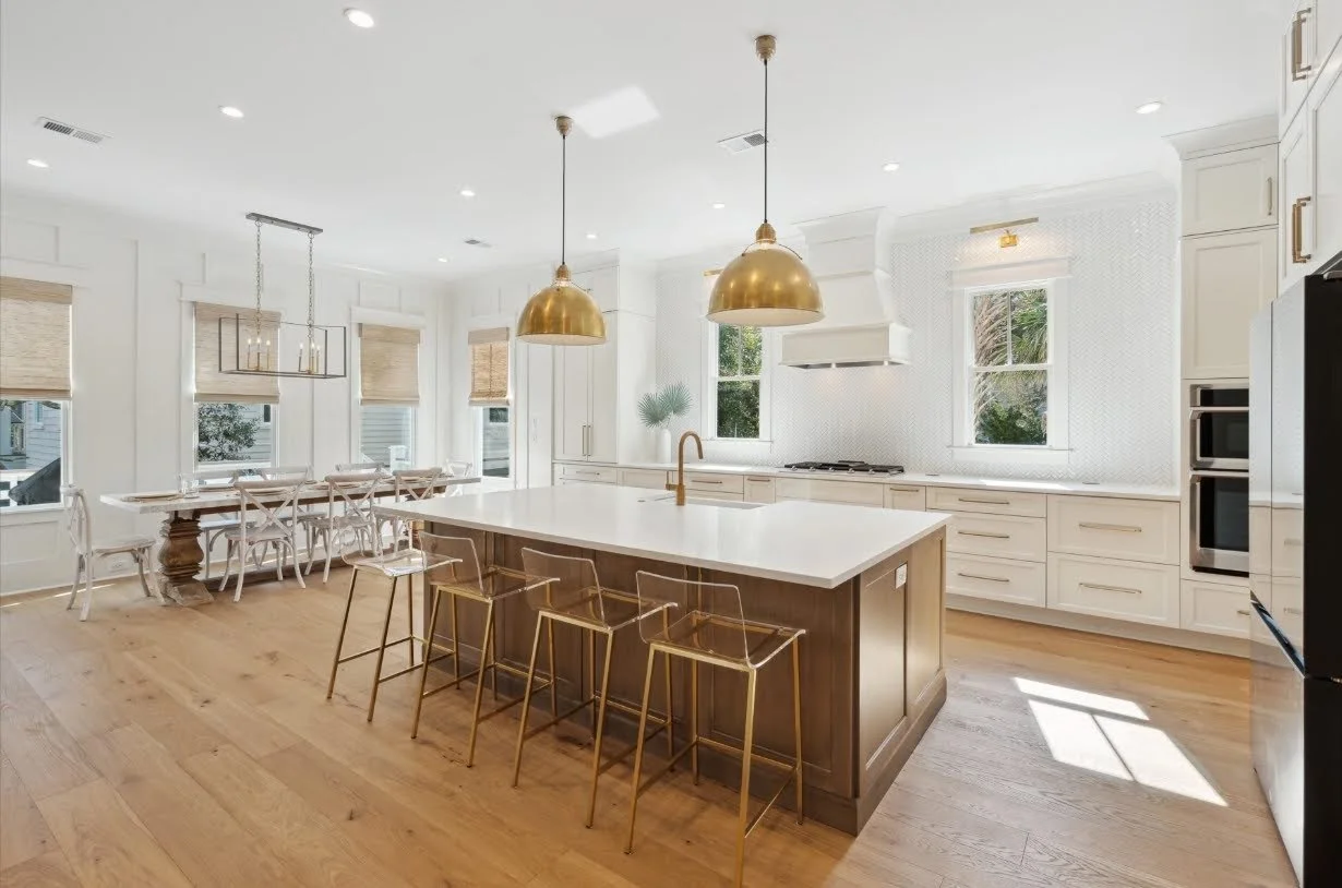 Kitchen island with brass pendant lighting in a luxury Isle of Palms SC custom home