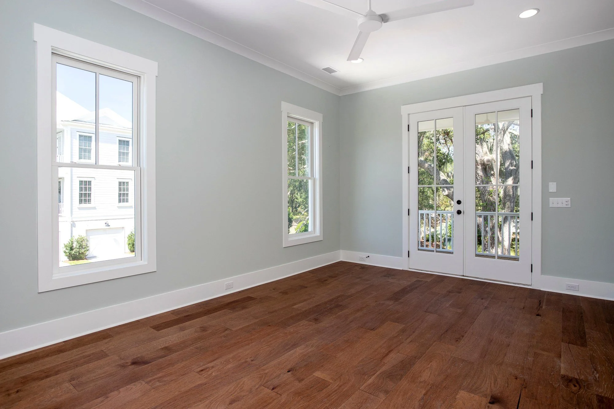 Main level bedroom with private porch access in a Johns Island SC custom home build