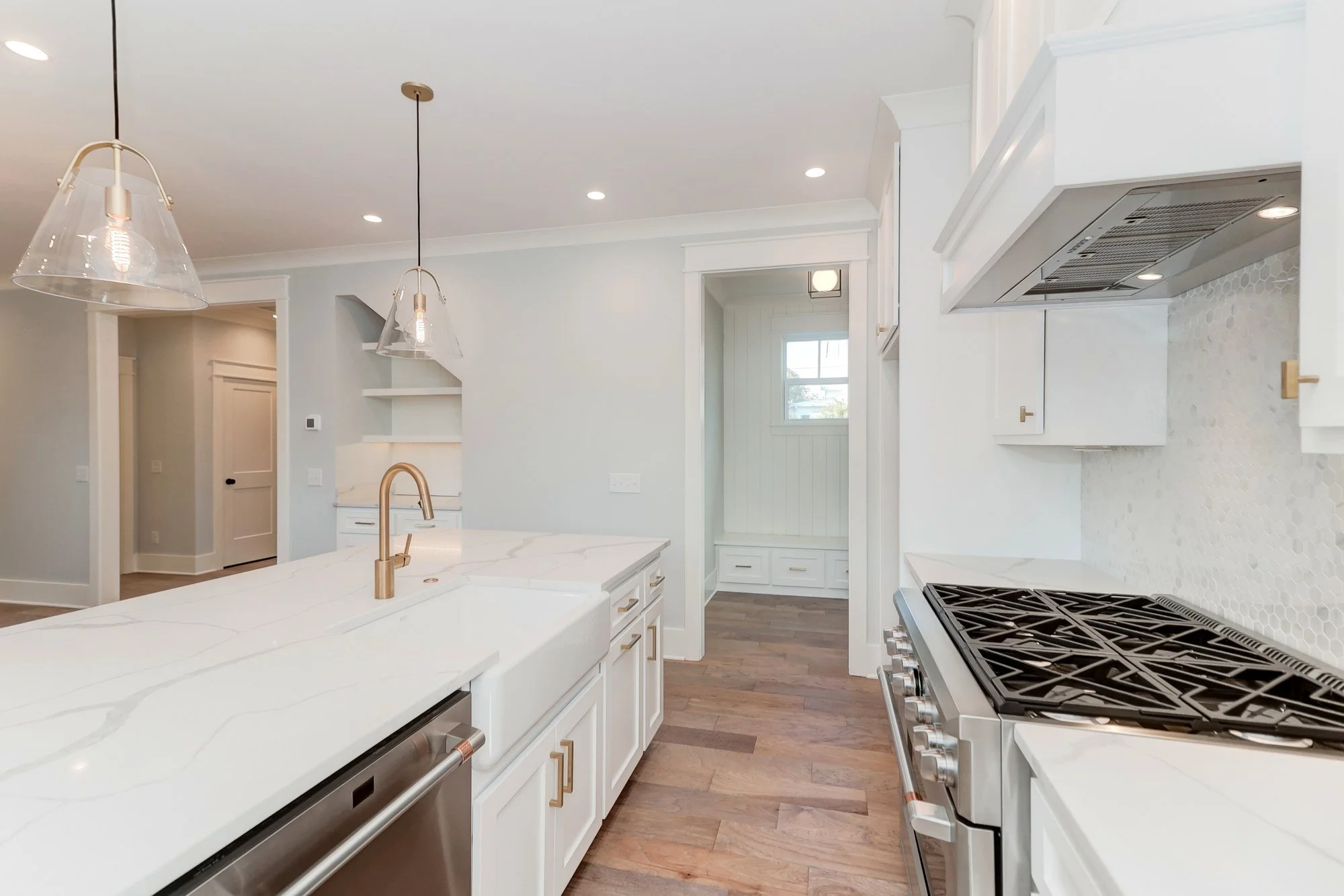 Kitchen range and custom plaster hood in a Mount Pleasant SC luxury custom home build