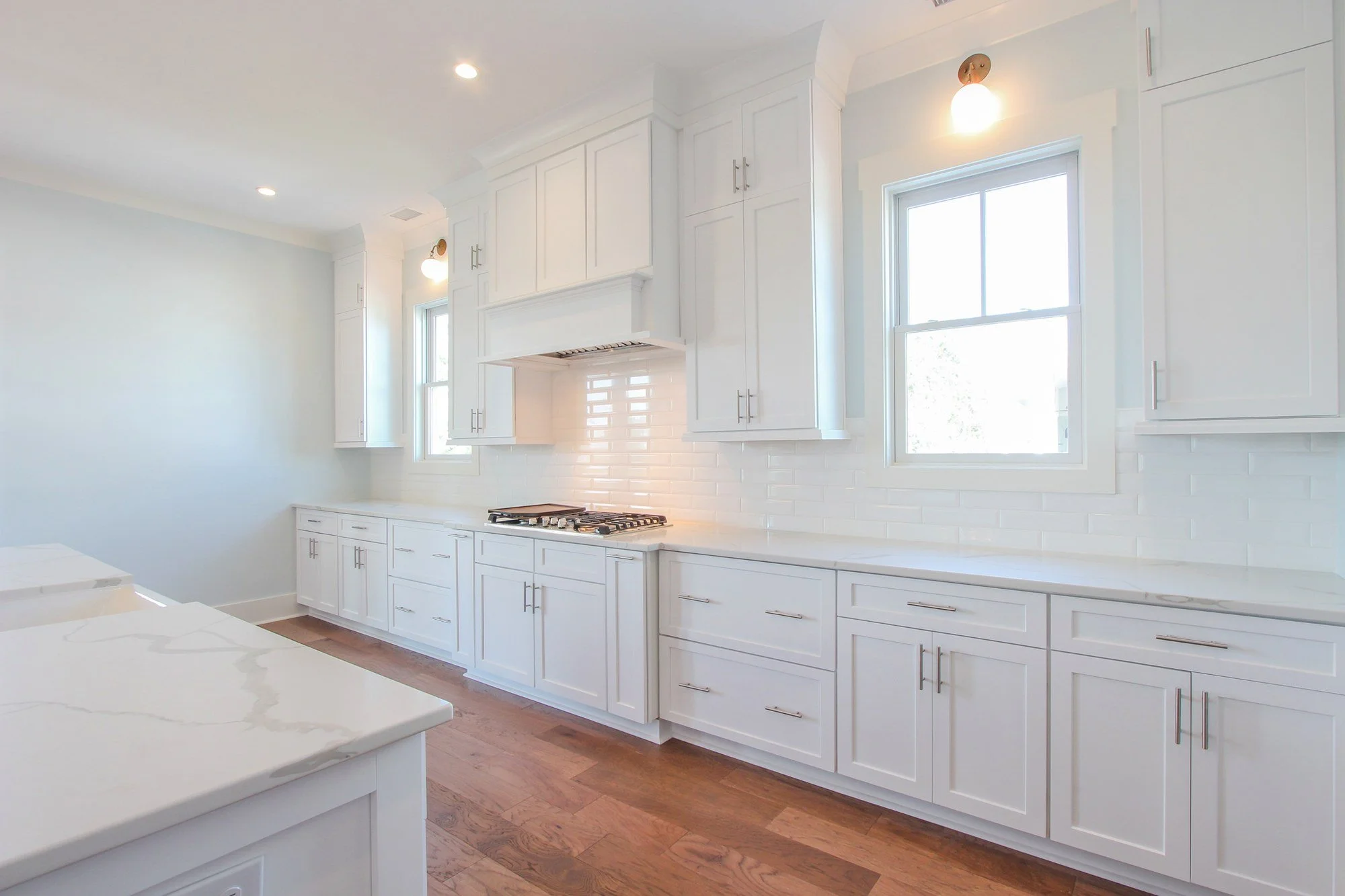 Kitchen range wall with subway tile backsplash in a Charleston SC luxury custom home