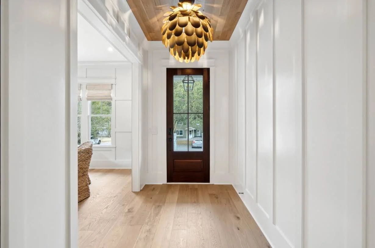 Foyer with mahogany front door in a luxury Isle of Palms SC home by Iconic Developments