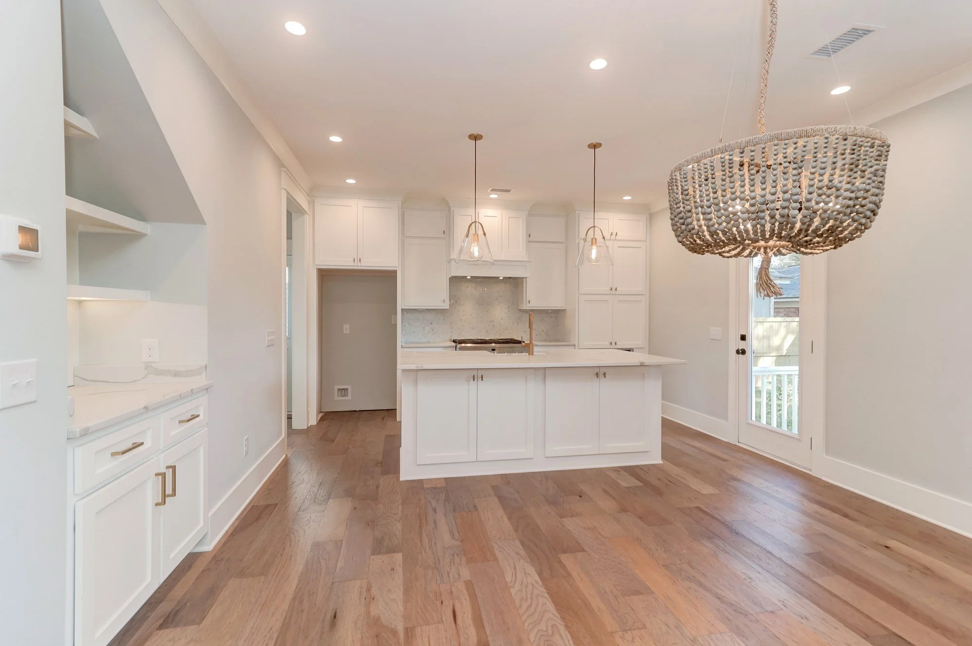 Kitchen with beaded chandelier in an Old Village Mount Pleasant SC custom home build