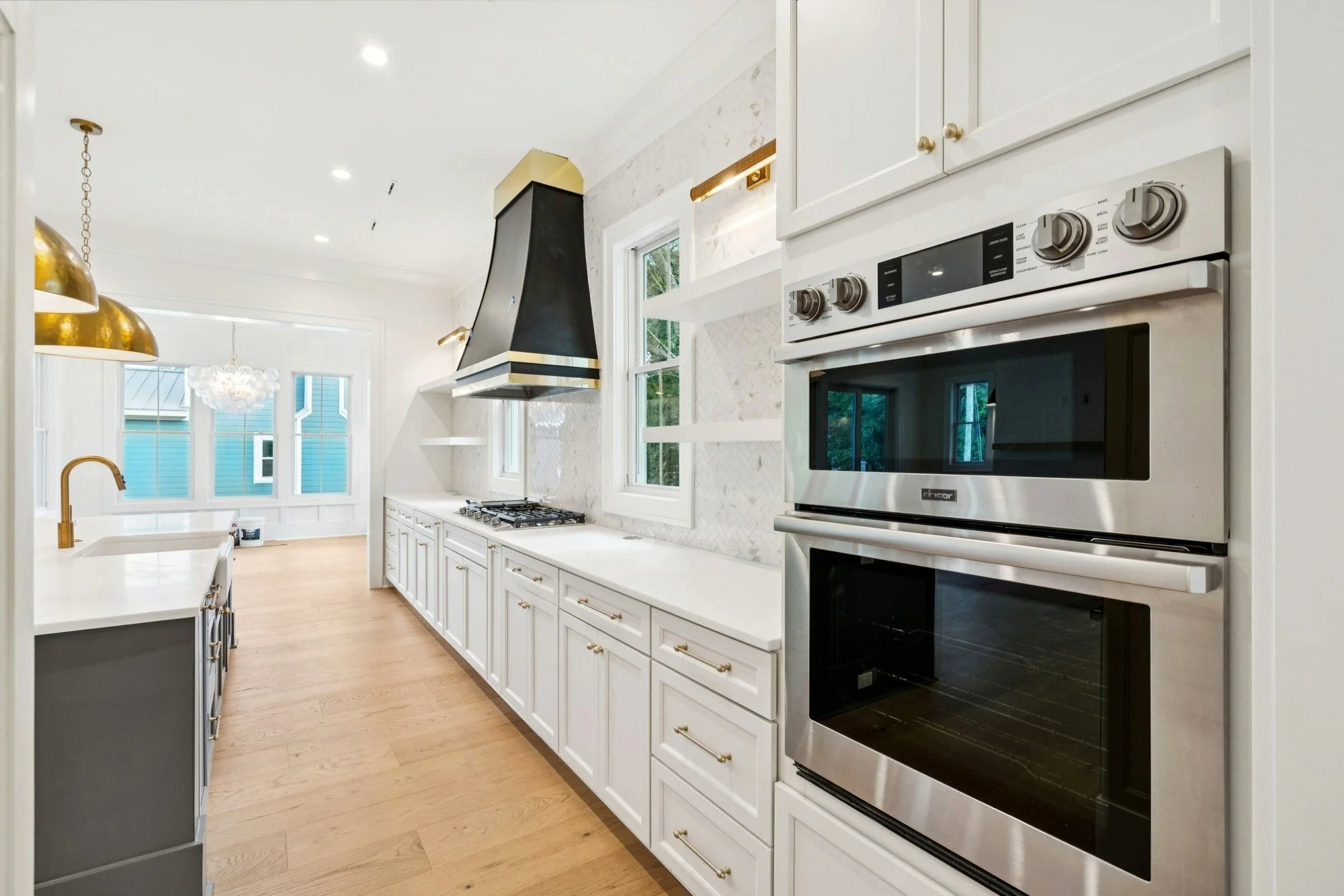 Luxury kitchen with double wall ovens in an Isle of Palms SC home by Iconic Developments