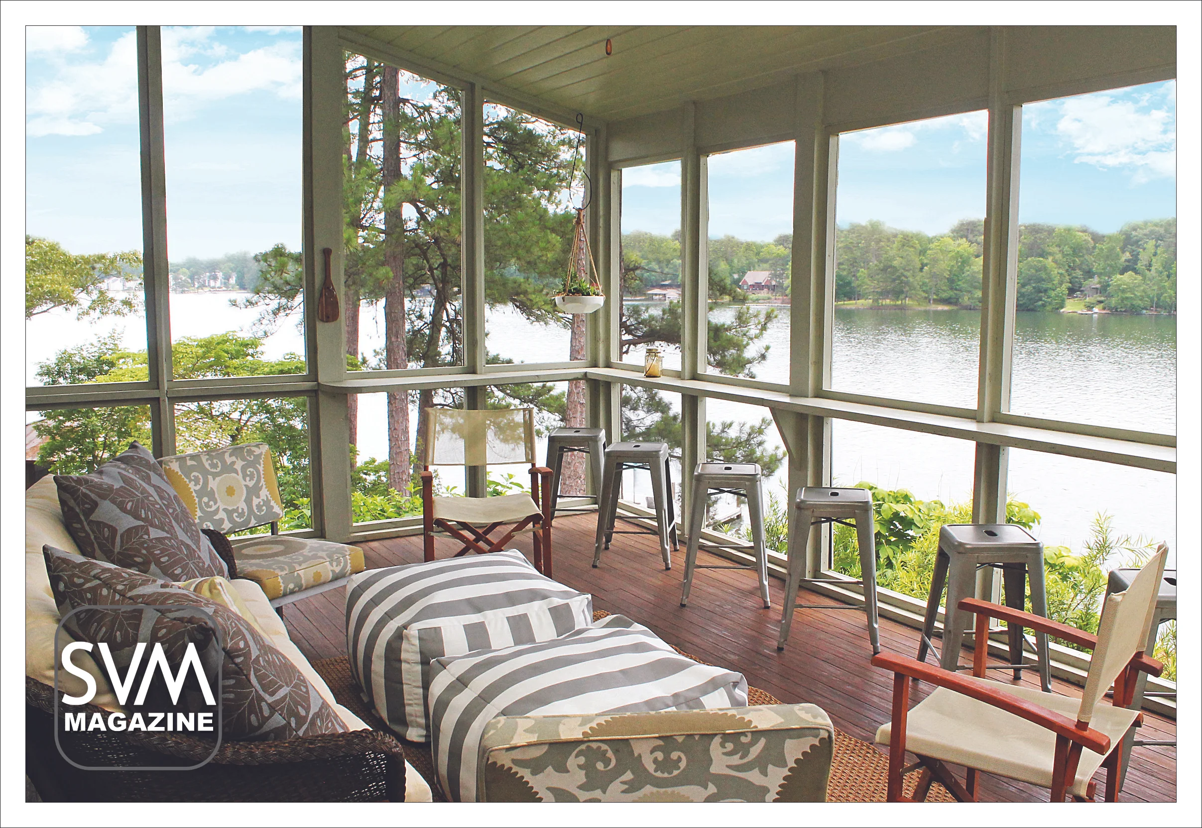 The back porch provides tons of seating with these antique, tin stools and a large couch. The family mixed floral and striped prints to give the outside space a casual, fun aesthetic. The bright blue and yellow colors pair seamlessly with the view of the water.