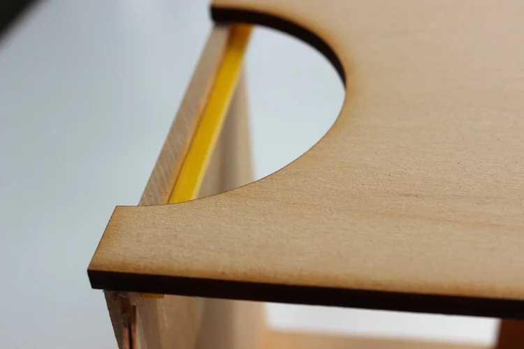 Detail shot of wooden model, featuring cutout + lighting system in each Coordinate