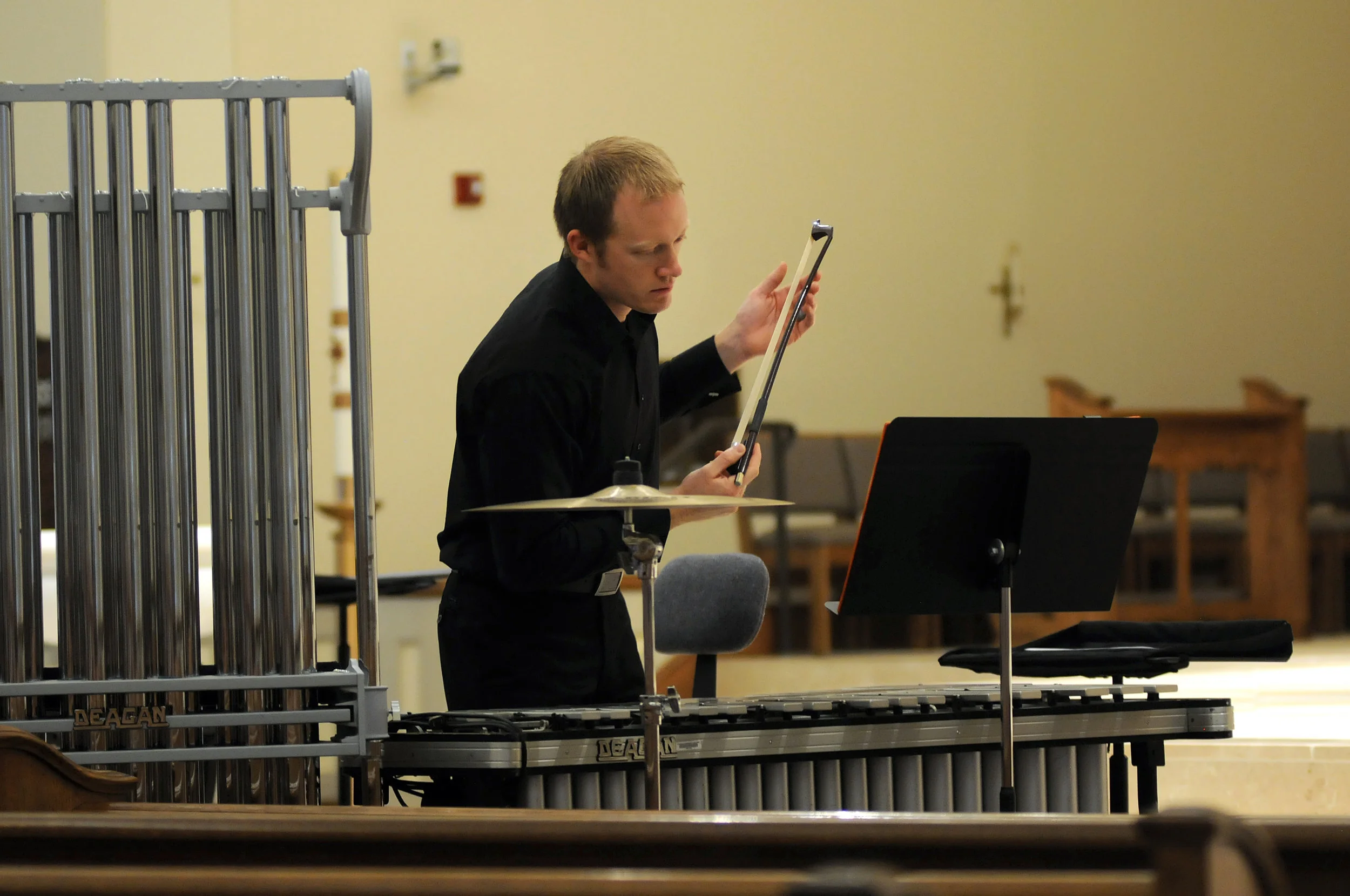  Why is he holding a bow? 