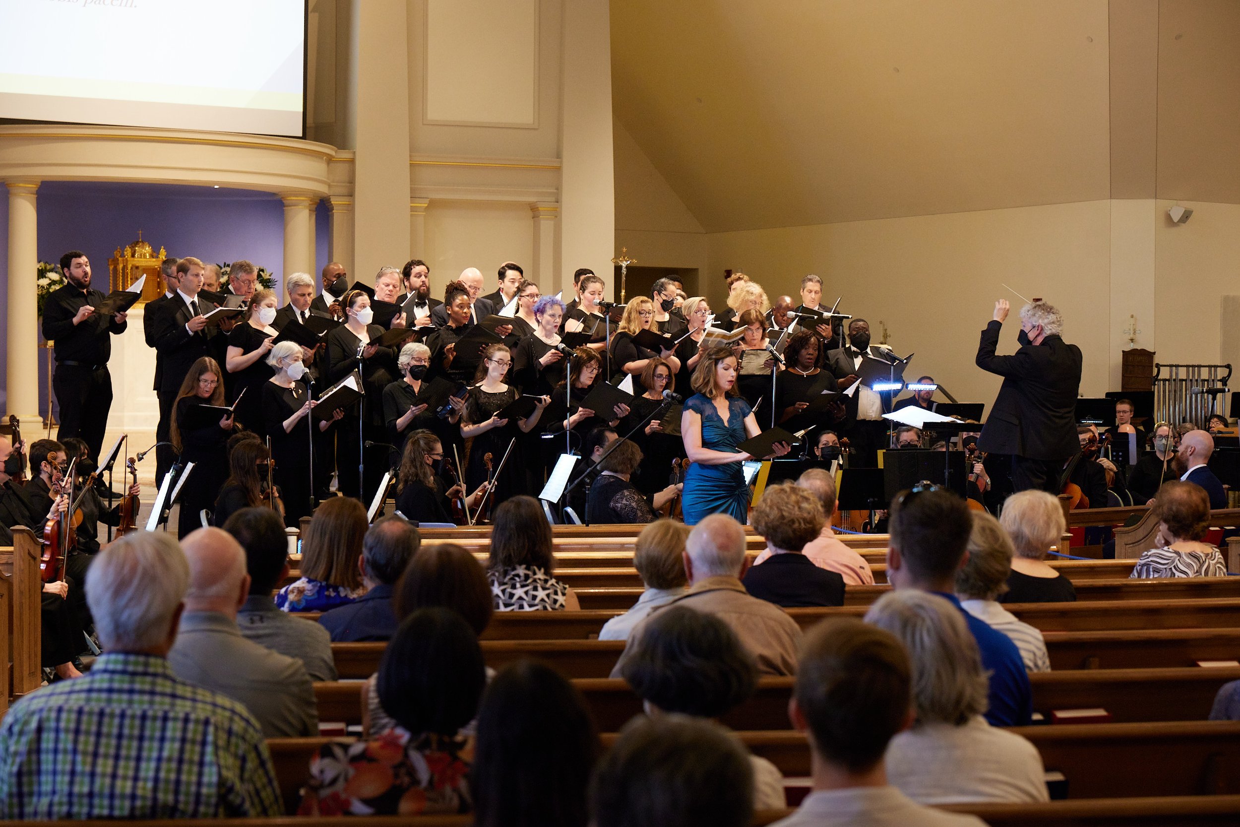 Colleen Daly sings the last, lowest, "Dona nobis pacem."