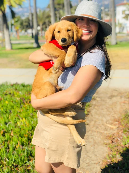 Elizabeth with one of her favorite pals, charlie, on east beach in santa barbara, CA.