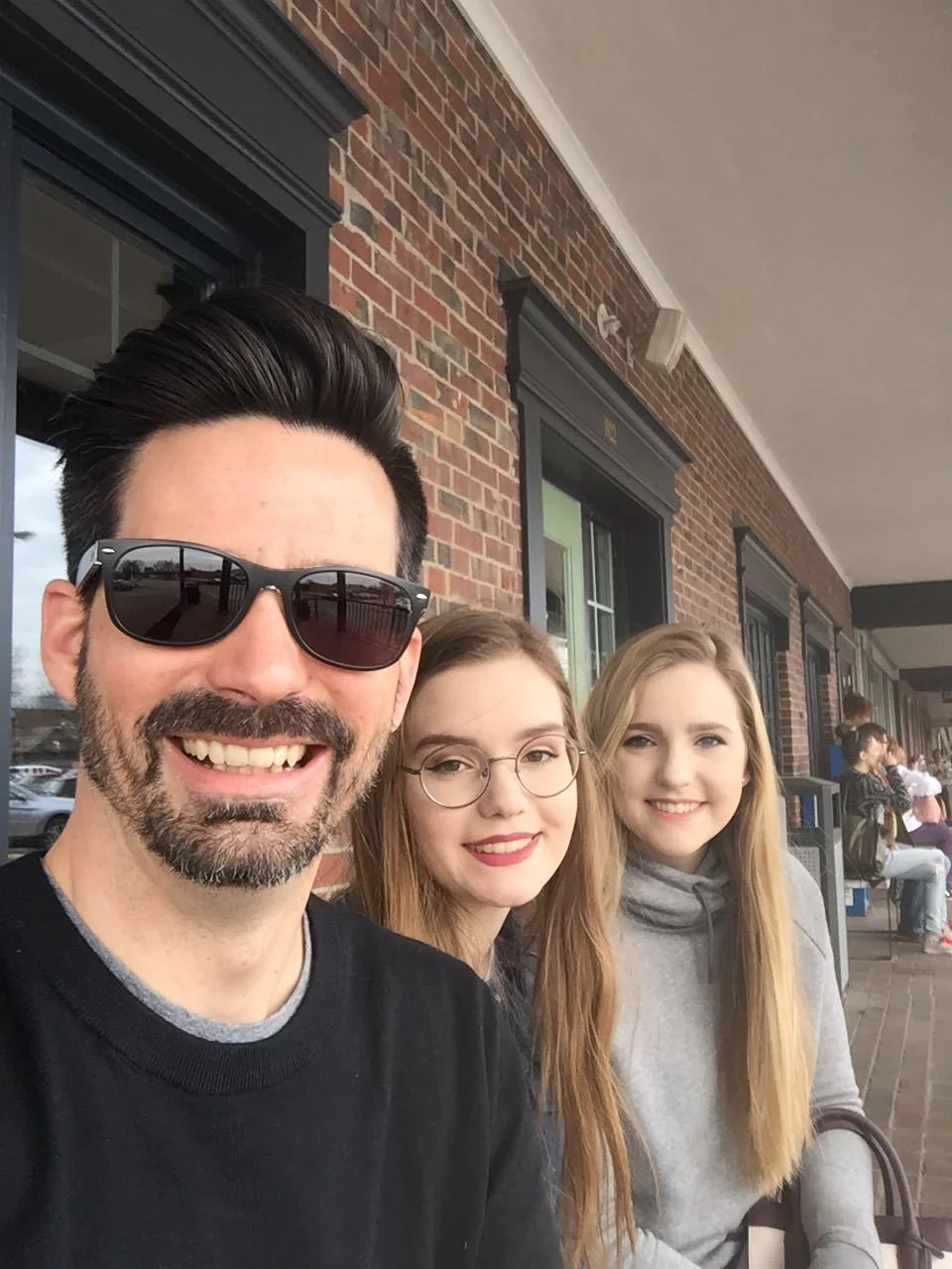 Jeremy with his daughters, isabel and alexia, waiting for a table at one of their favorite breakfast joints, first watch. they love breakfast!