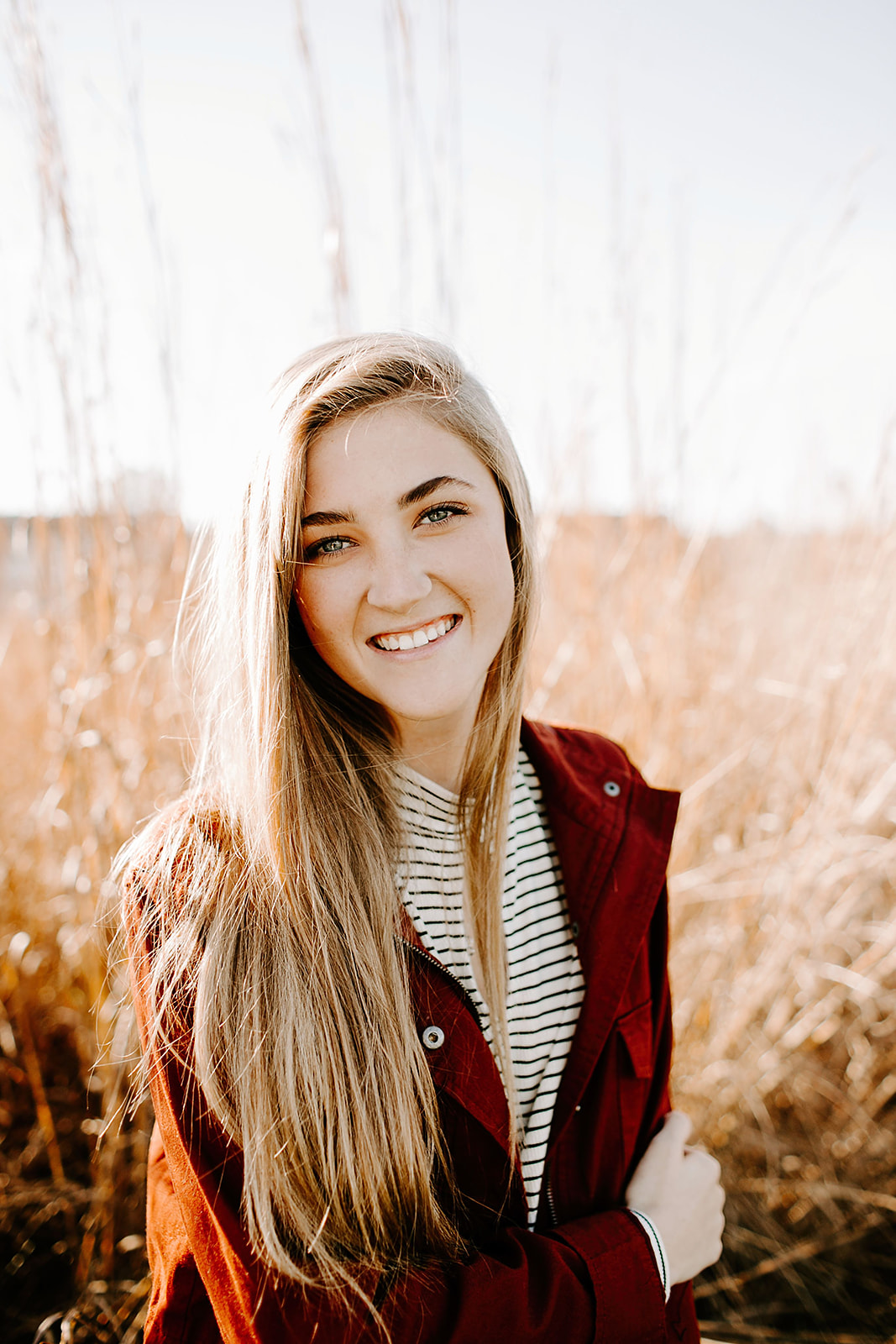 a senior photo at their senior session in the field  at Carmel, Indiana