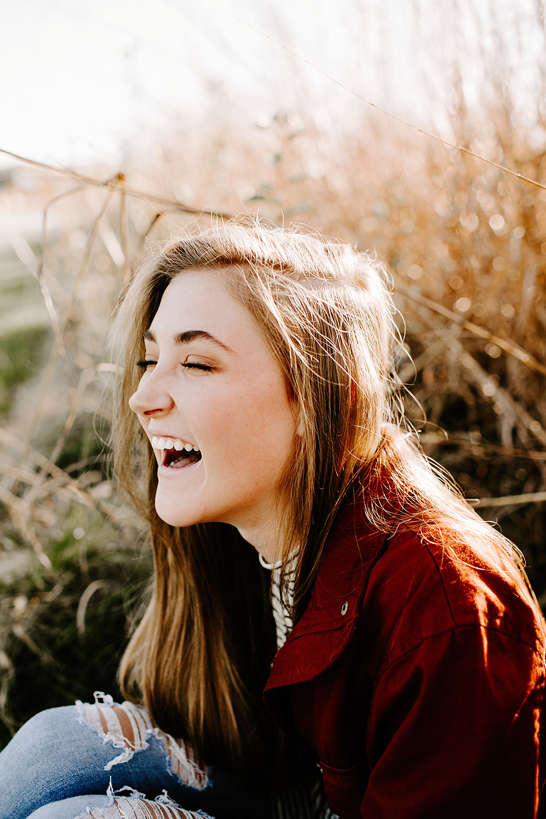 a senior photo at their senior session in the field  at Carmel, Indiana