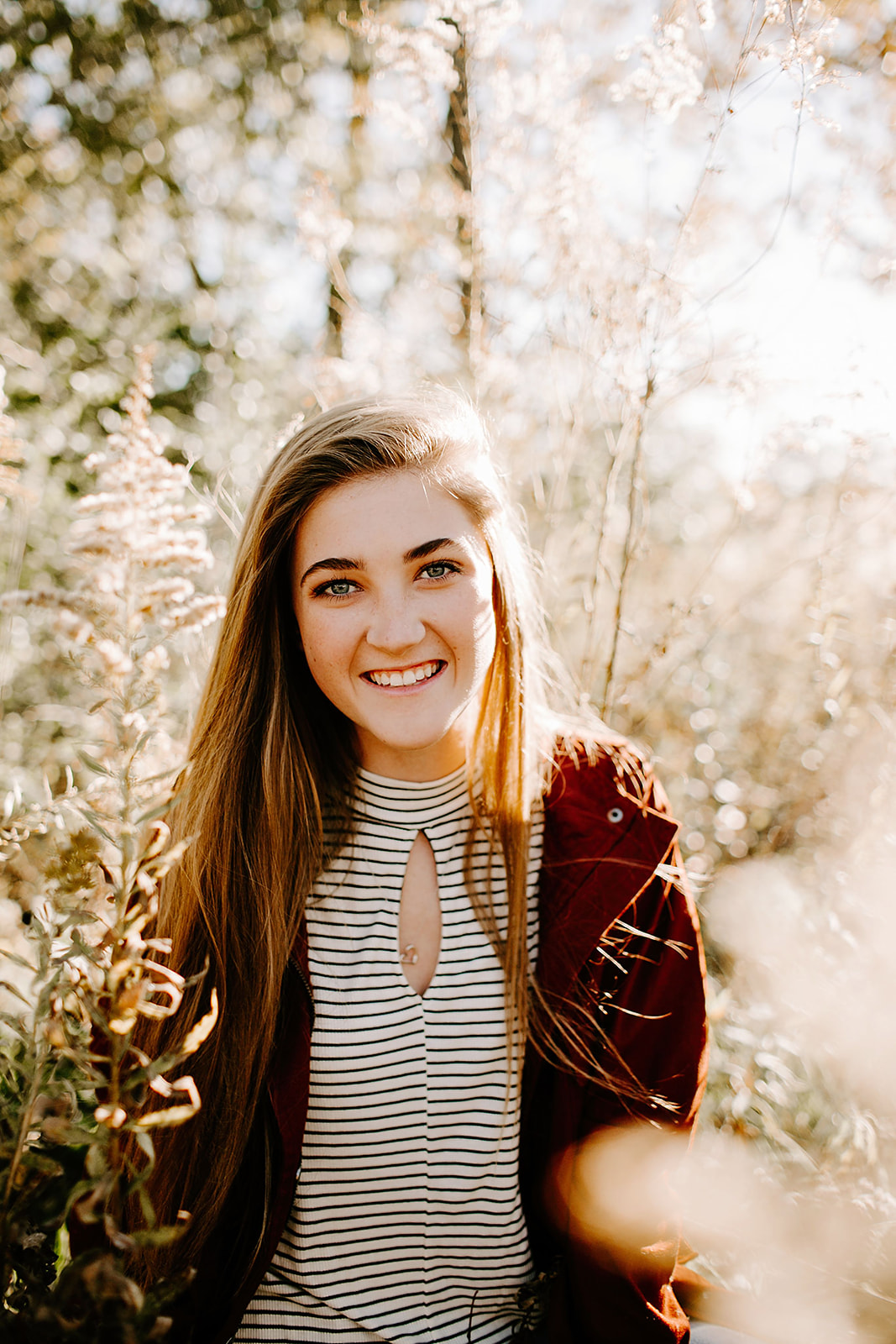 a senior photo at their senior session in the field at Carmel, Indiana