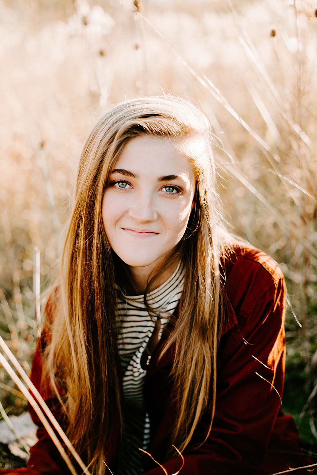 a senior photo at their senior session in the field at Carmel, Indiana