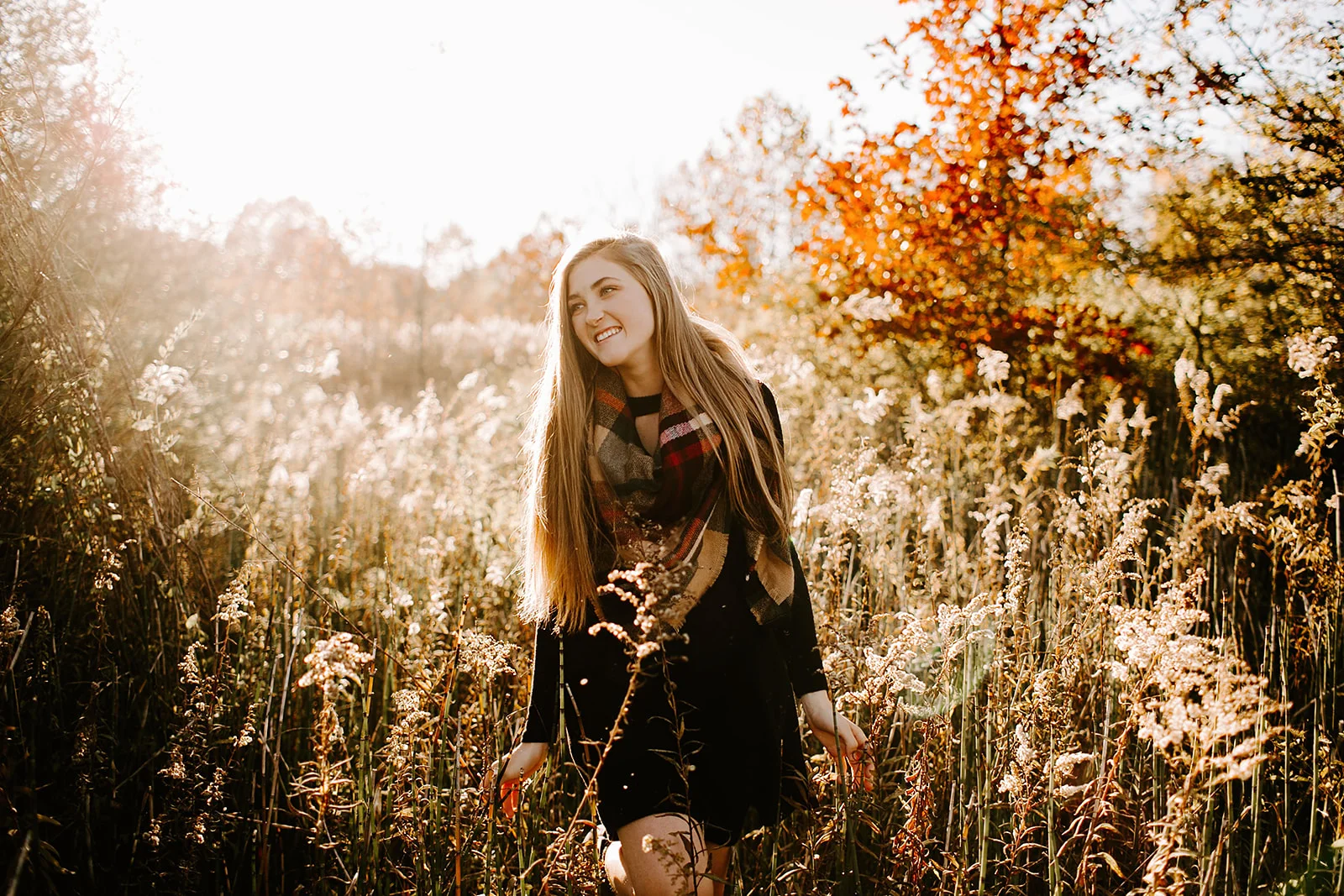 a senior photo at their senior session in the field at Carmel, Indiana