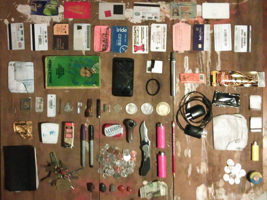 moleskine keys purple sharpie micro sharpie natan meteorite hematite moonstone carnelian x2 change tin glass pipe knife 2 dollars pink bic lightersx2 pencil charger partial bill change container lighter matchesx2 siriacha packetx2 zig zag wrapsx2 silver paint marker matches hair tie brass check 1922 liberty head silver dollar 1903 Liberty head silver dollar *previously belonging to the estate of Helen Frankenthaler philippine coin brass object* magnet mastodon ivory can opener guitar pick bobby pin cardx2 micro sd cardx2 w/case condom dental floss tin mail-folded joseph conrad-hearts of darkness cell phone state id cardsx11 bus pass stewarts milk card moma membership 