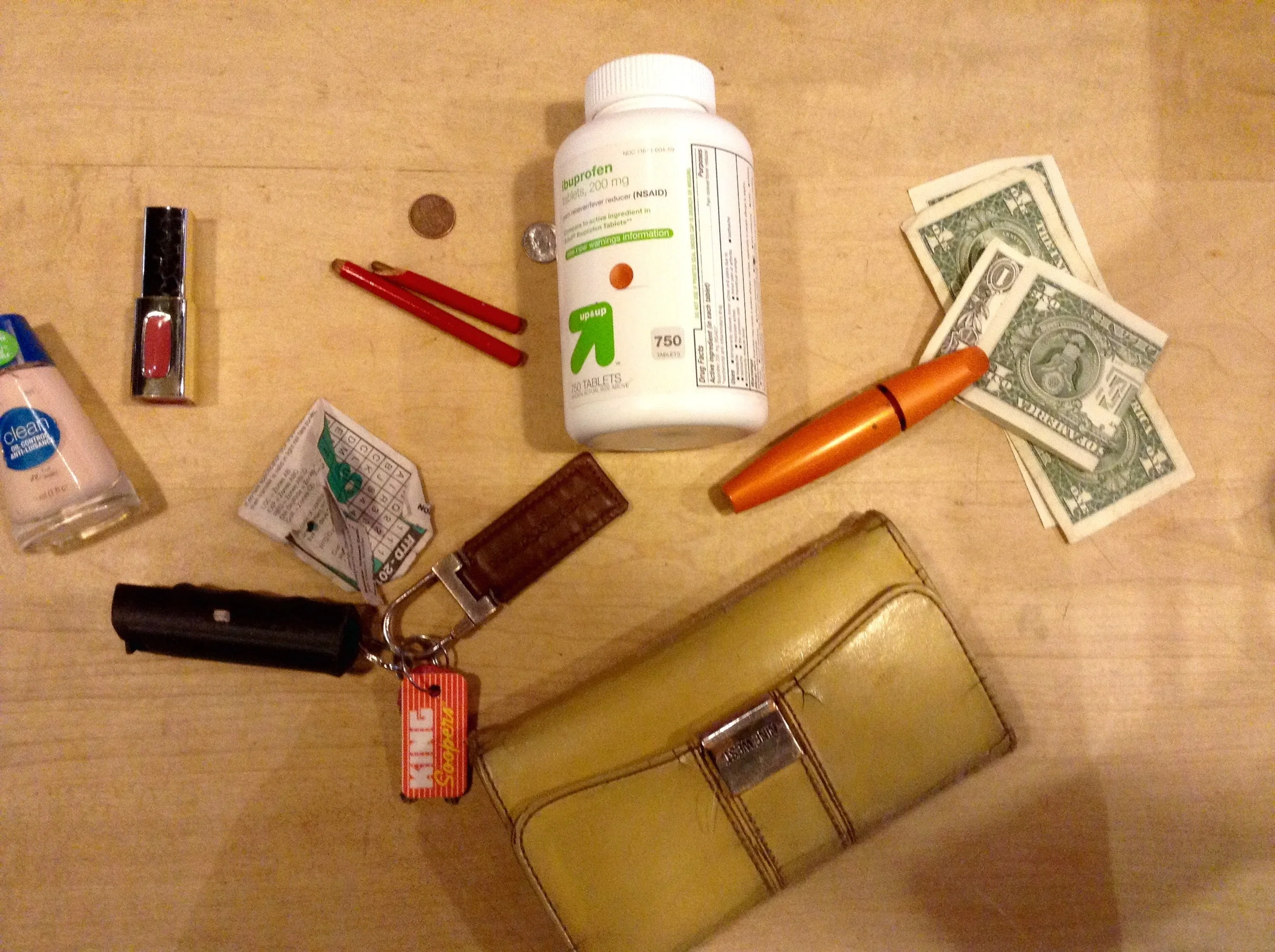   Keys with pepper spray   Bus fare   Broken sunglasses   Cigarettes   Wallet   Gum   Free bus ride ticket   Dispensary punch card   Red lipstick   Chocolate porter flavored chap stick   Secret Santa scrap   Eyeglasses wiper    