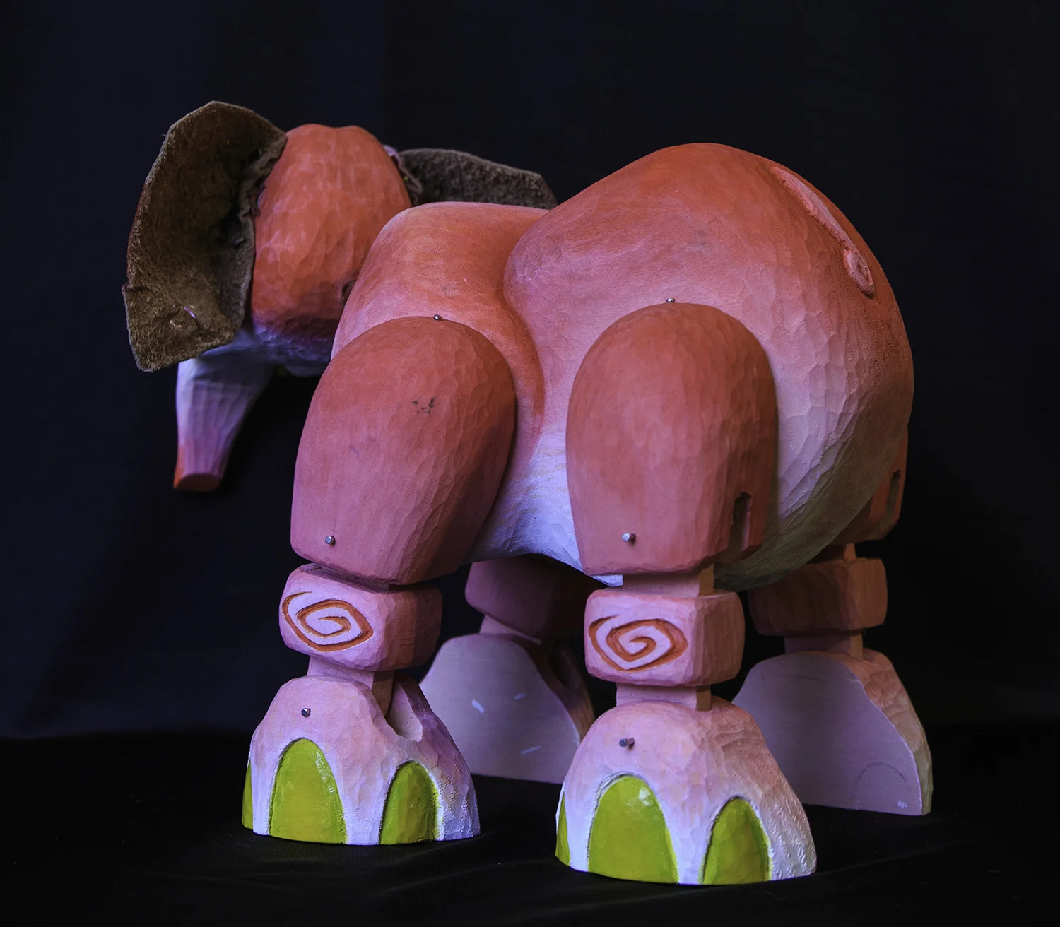 And here is Peanut! He is my favorite. He is made from wood (15 separate carved pieces fit together), plastic flowers, and upholstery leather. He is fully posable and built in a marionette style. Photo by Richard Casteel. http://www.capturingmilliseconds.com ~ SOLD 