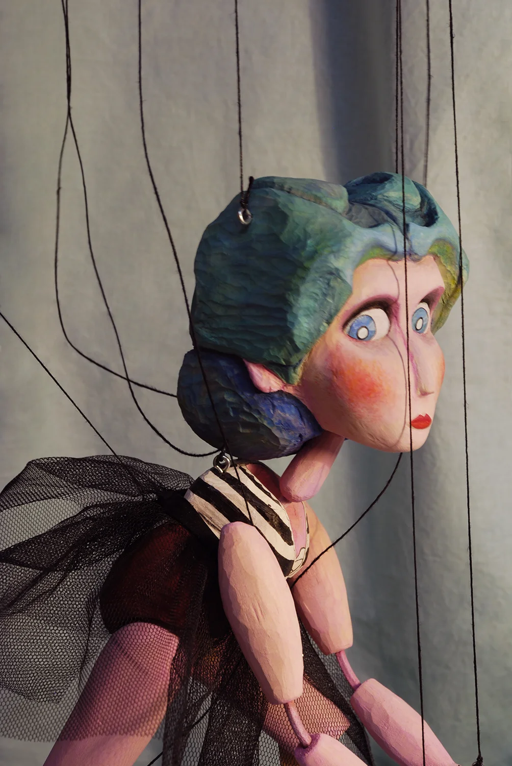 This is Delilah, the Strong Woman. She was the very first marionette that I built, as well as the largest. she stands a little over a foot tall. She is made of wood and leather and fully manipulatable. She performed in the 2011 Prague Quadrennial Festival in a street production. ~ SOLD