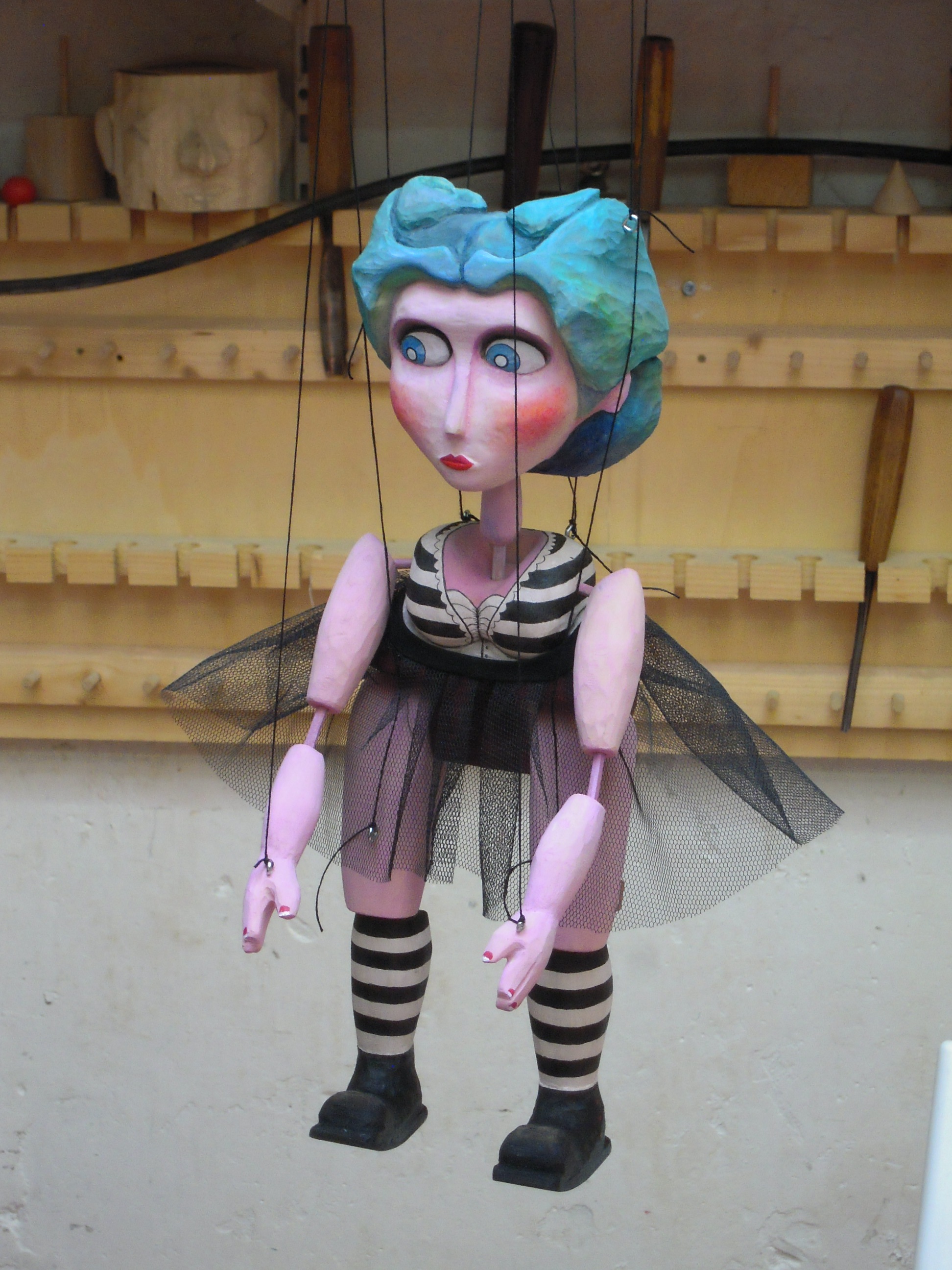  This is Delilah, the Strong Woman. She was the very first marionette that I built, as well as the largest. she stands a little over a foot tall. She is made of wood and leather and fully manipulatable. She performed in the 2011 Prague Quadrennial Fe