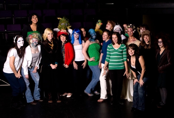Tara Cooper with her Advanced Makeup Design class showing off their final exam Makeup Design projects. 