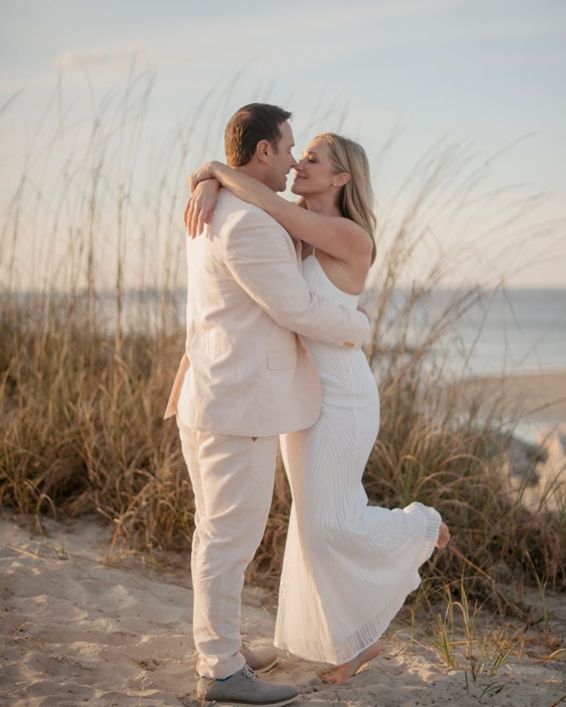 A beautiful moment after Addi + Daniel&rsquo;s elopement where close friends were the ones celebrating with them. Chosen family is a beautiful thing in this life. So are sunsets on Tybee 🌾 Planning: @simplyeloped