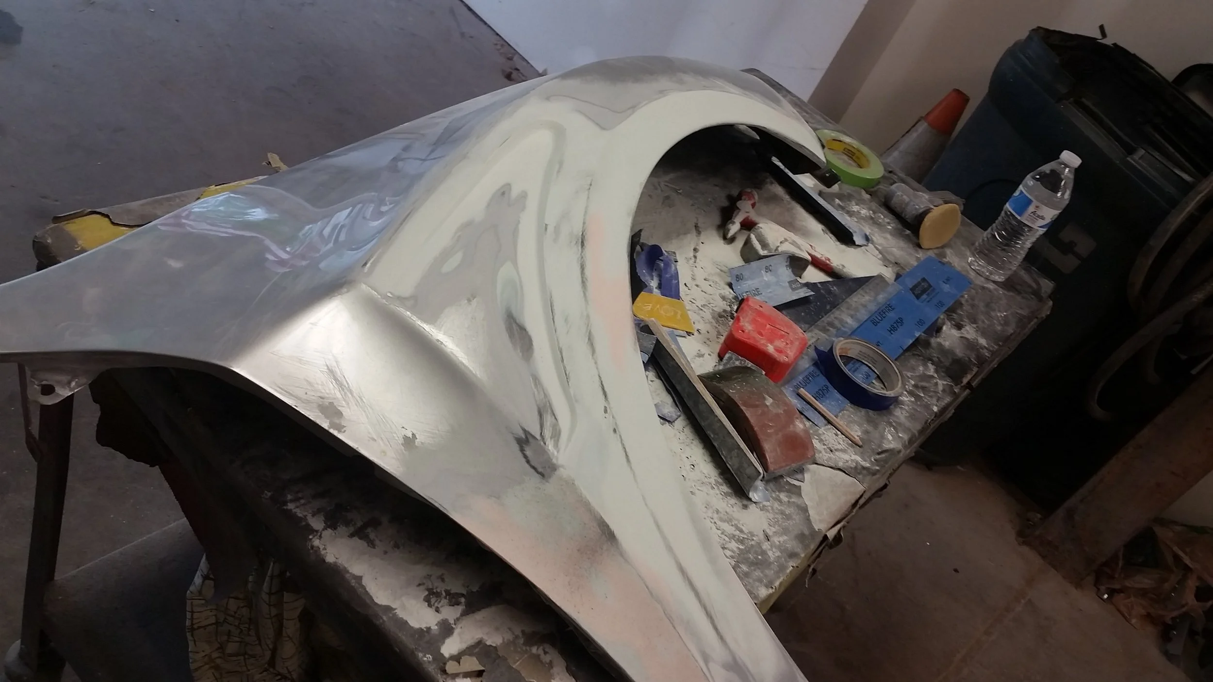 -bodywork was started to smooth out the new vent creation and to smooth the previously closed off plastic vent. 