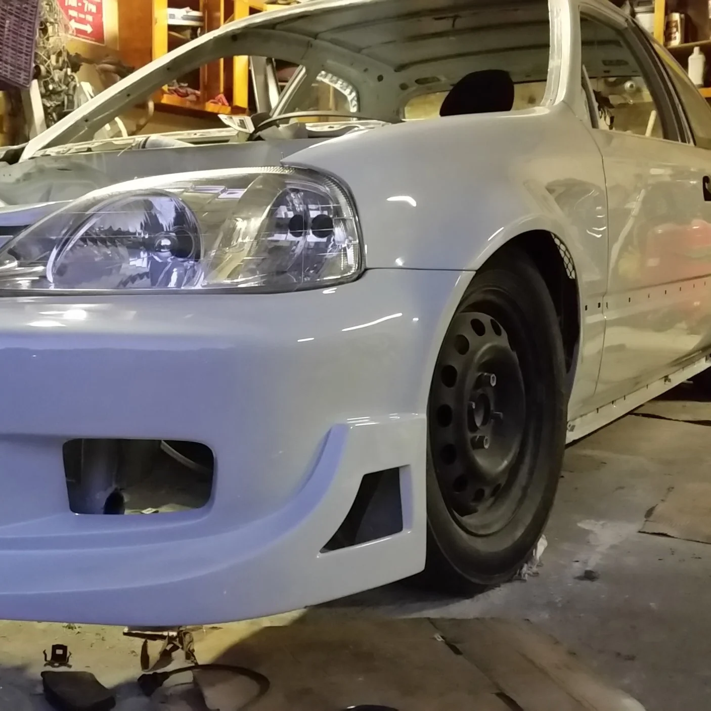 -all complete, assembled, and painted. the "fender to bumper" fitment being perfection 