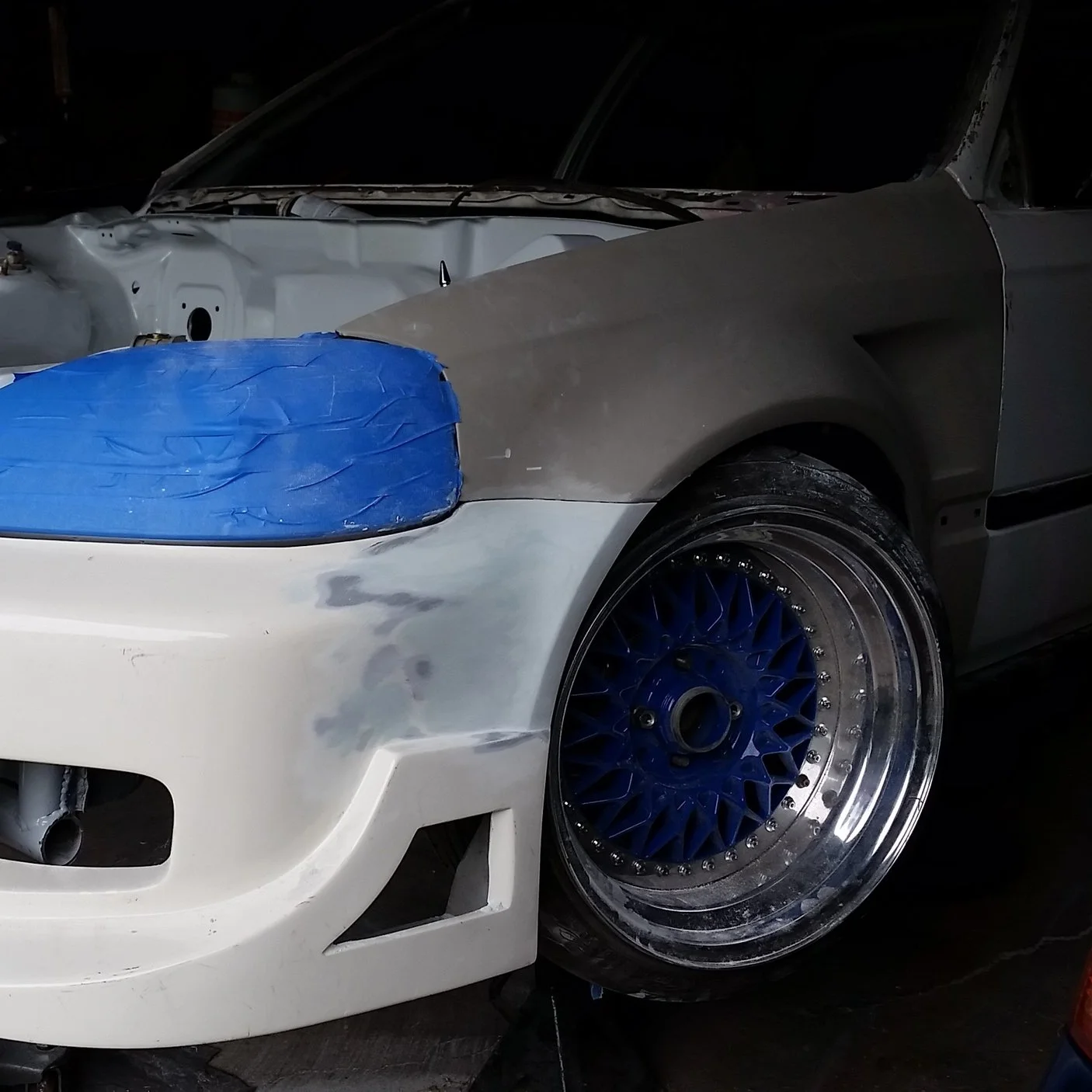 -since the fenders were widened 45mm, the front bumper will also need to be modified to fit the newly placed mounts on the wide fender. The bumper was widened in fiberglass work to meet the fender like "oem" fitment. nice gaps