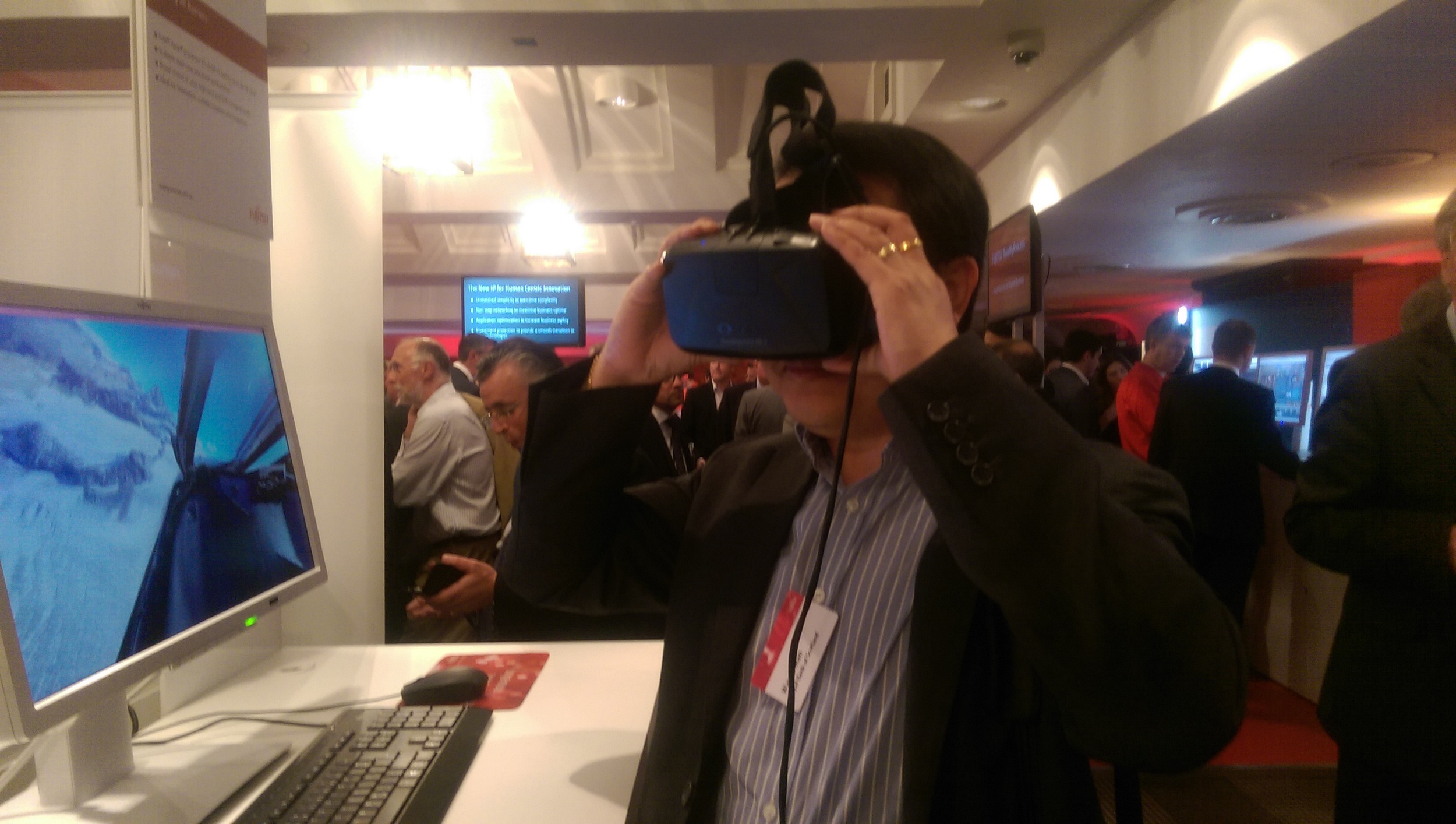 The 3D view from the cockpit with an Oculus Rift in the busy demo hall.