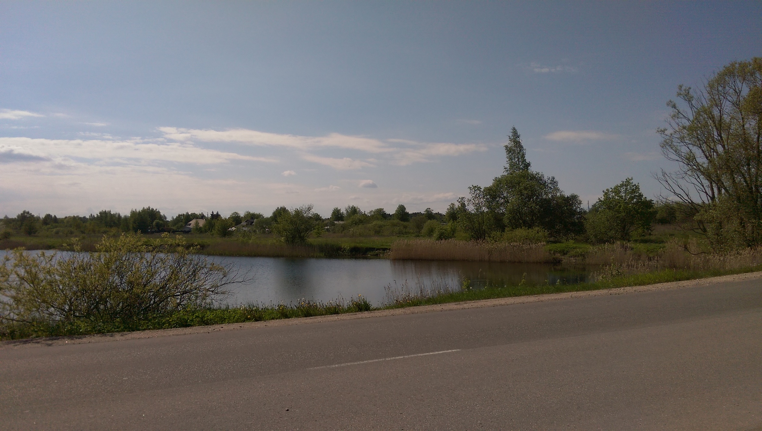 Seperate view from the bottom of the lake. If you look at Google StreetView for the area you'll see people enjoyin the lake in summer and apparently people enjoy diving in it also. Navigate a little down the road and you can see the remains of the old windmill also.