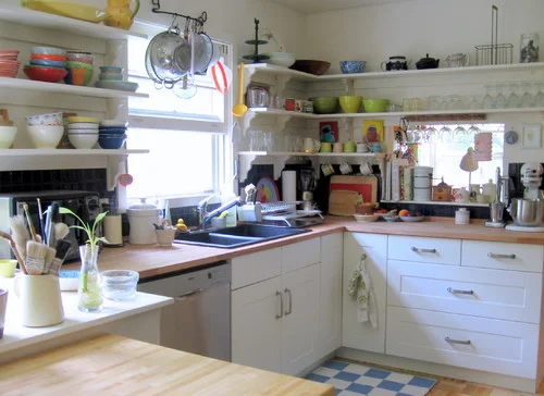 Cluttered open concept kitchen.