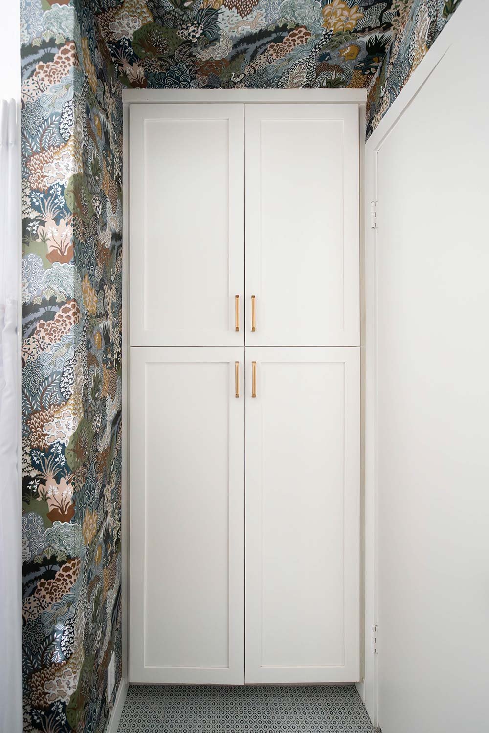 white linen closet intigrated into wall