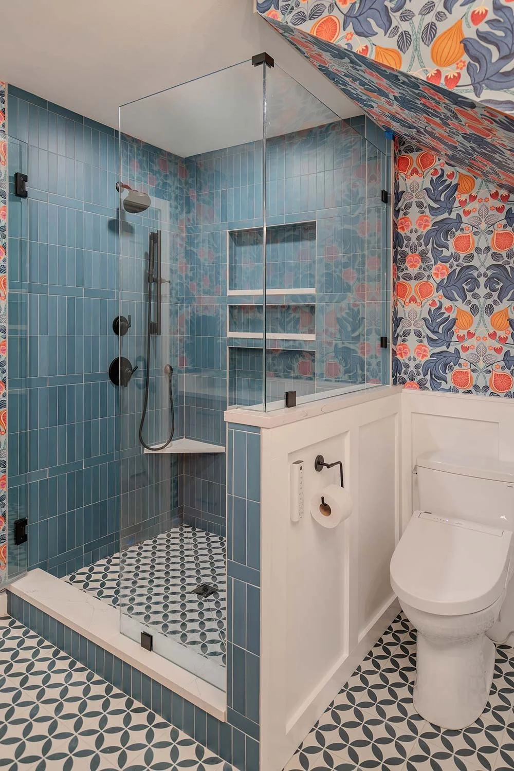 Glass door walk in shower with blue tiles