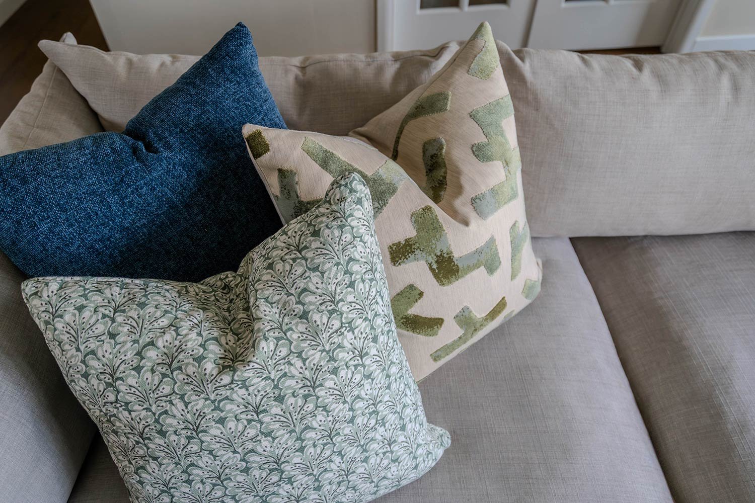 unique pillows on couch adding pop of color to your home