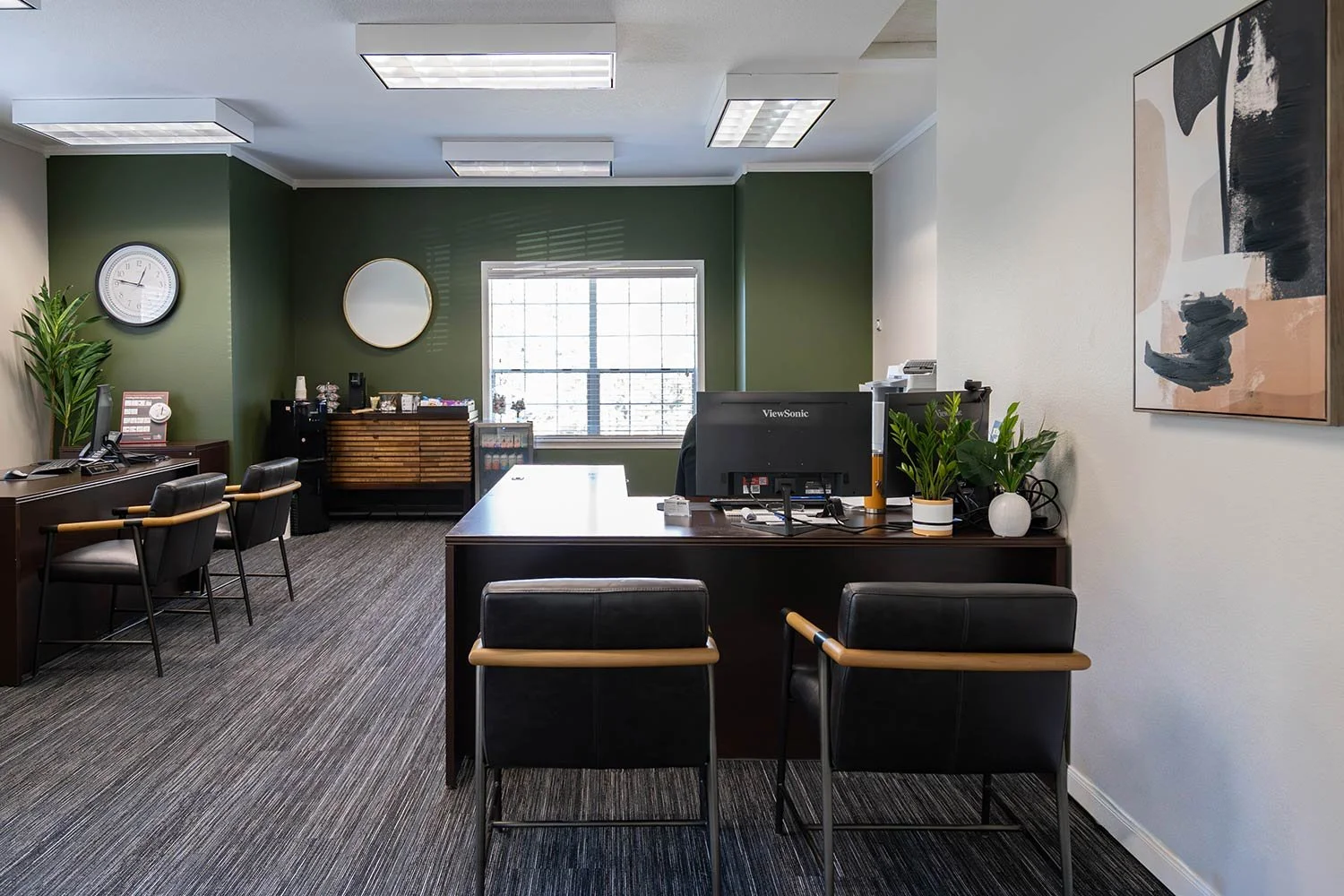 Leasing office space with green accent wall