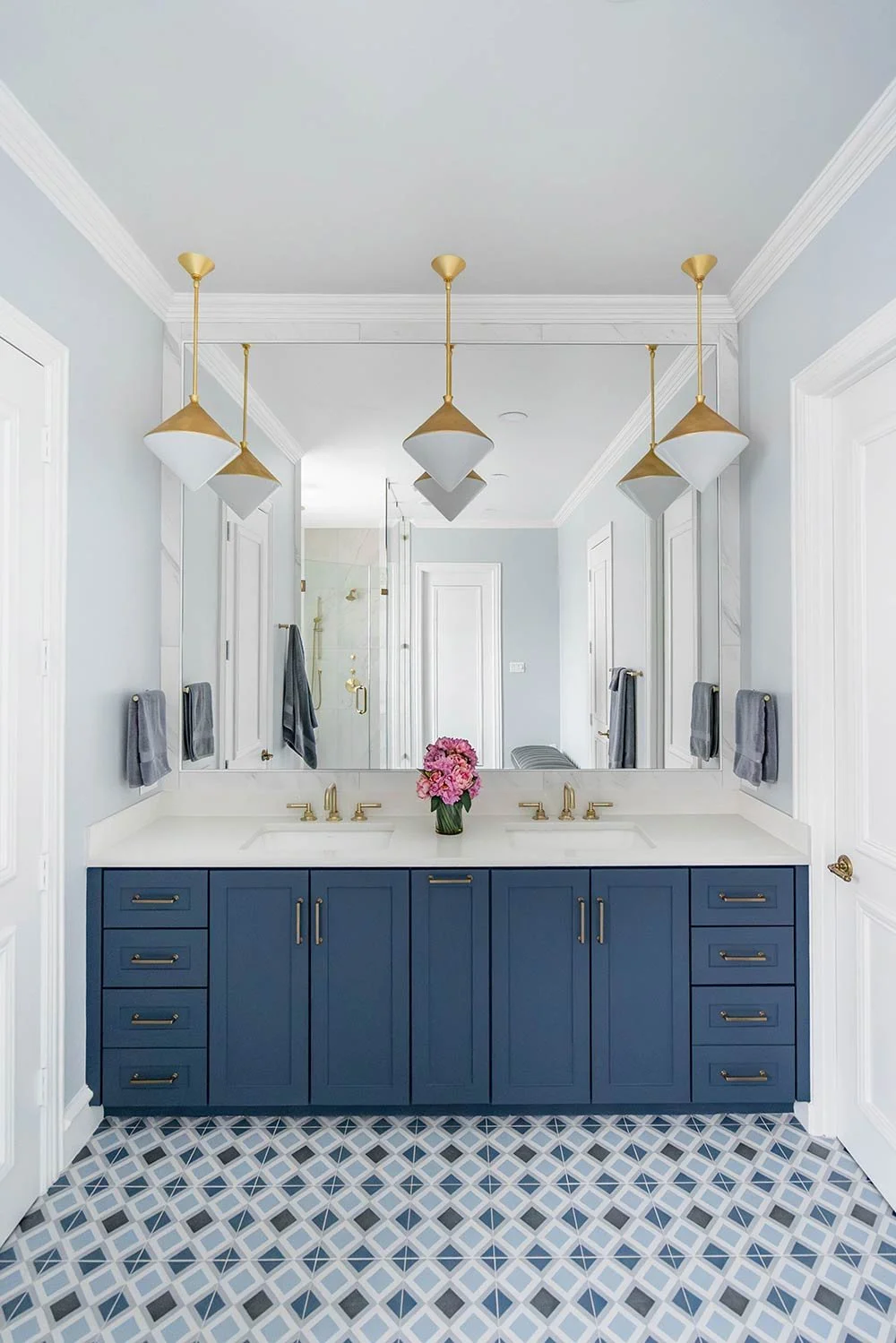 blue vanity in primary bathroom