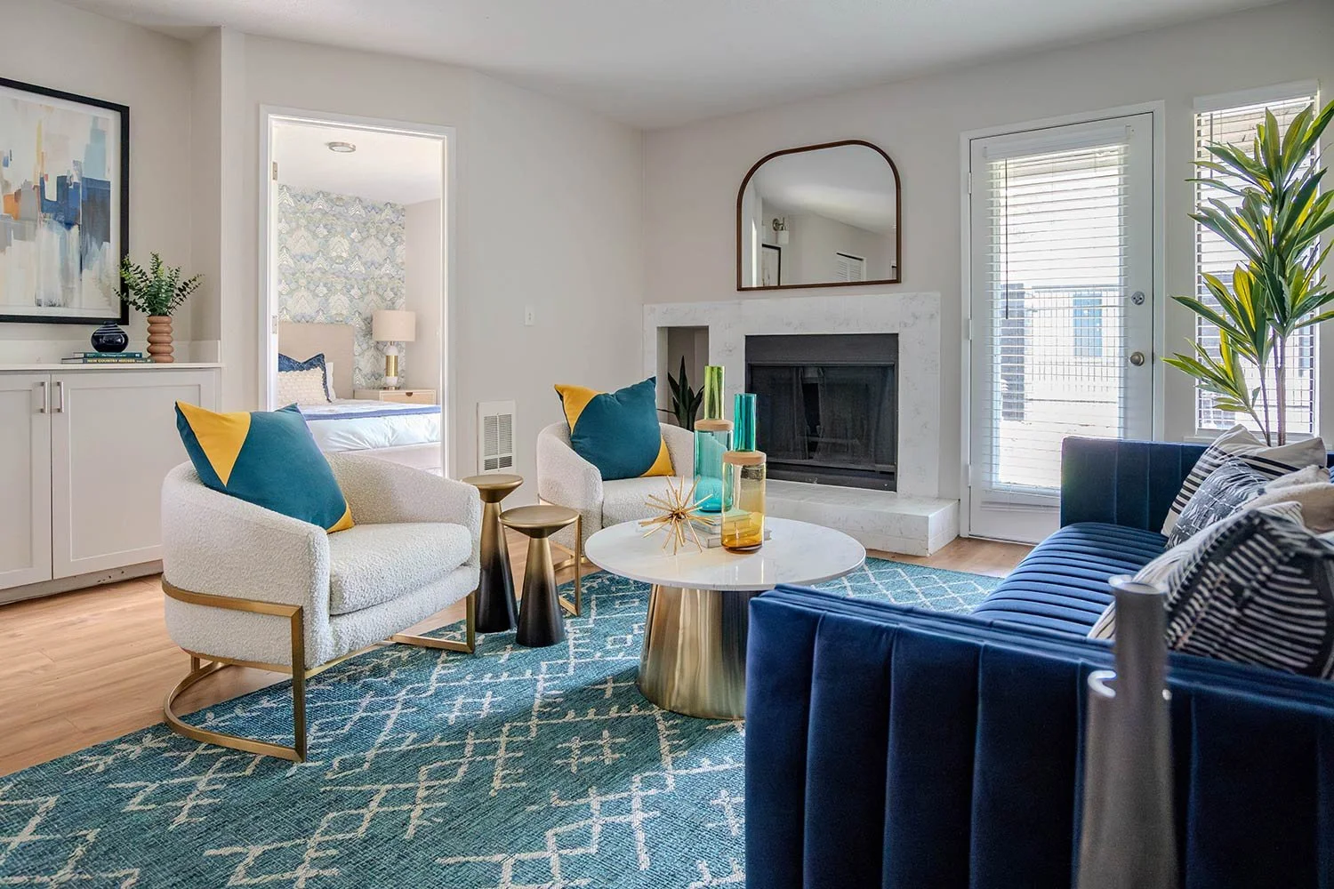 blue sofa in living room with colorful design