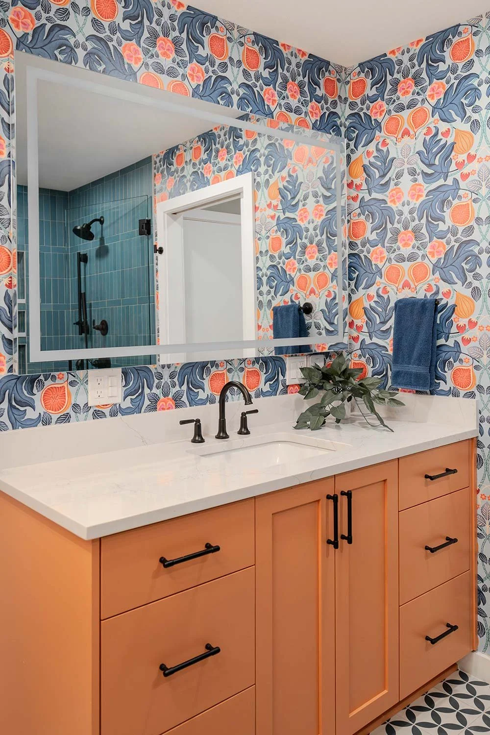orange vanity cabinet in colorful bathroom design