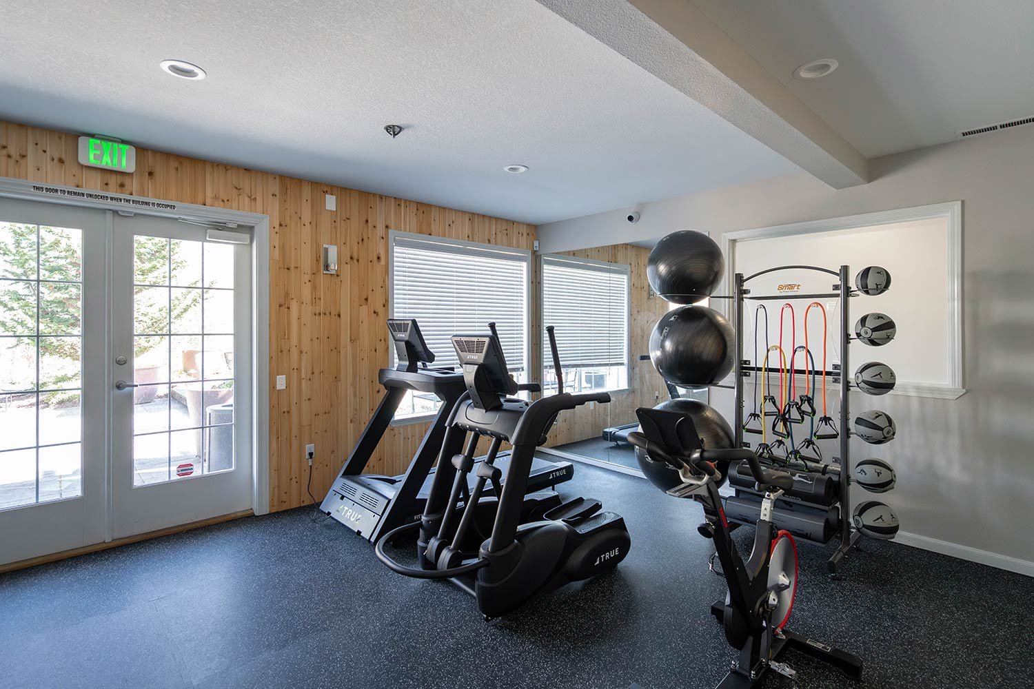 wood panelled walls with gym design