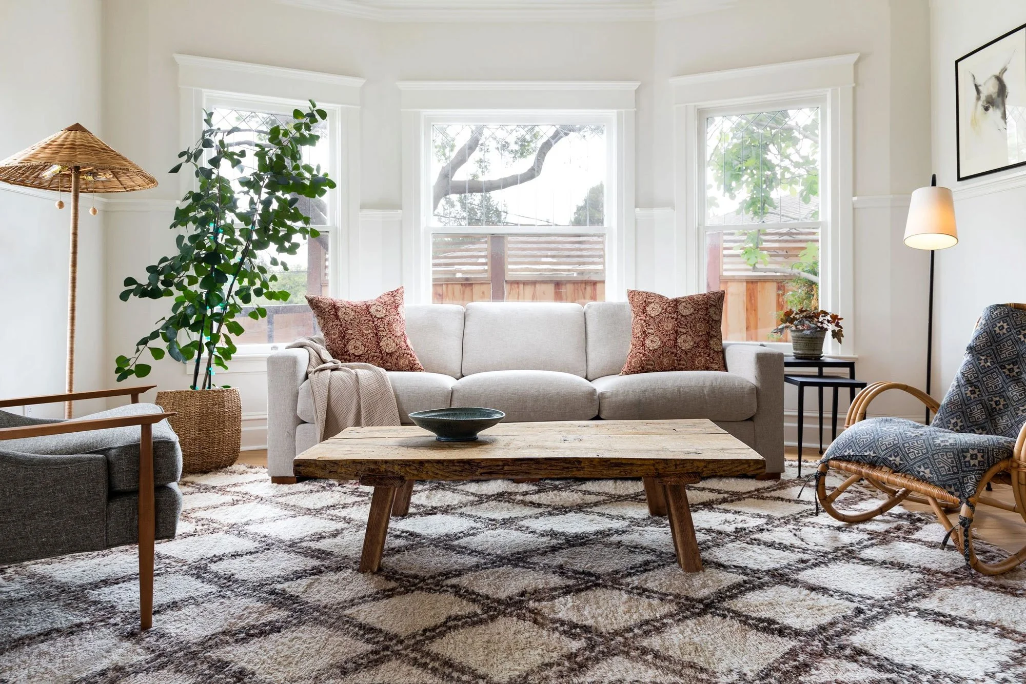 a brightly lit and beautifully designed living room