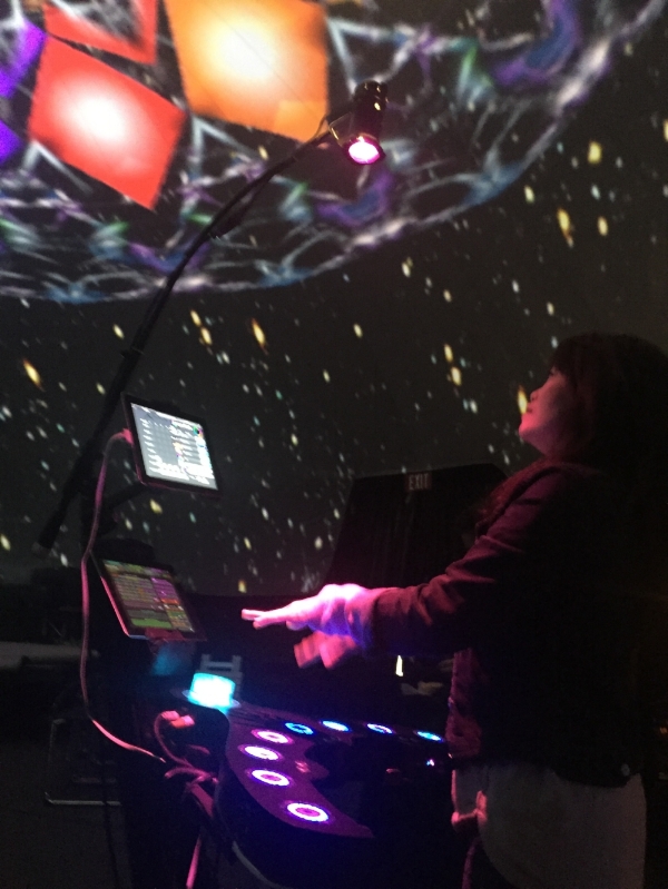 SpaceHarp touchless motion music and visuals controller in Vortex Dome LA. SpaceHarp player generates live music and seamless fulldome art!