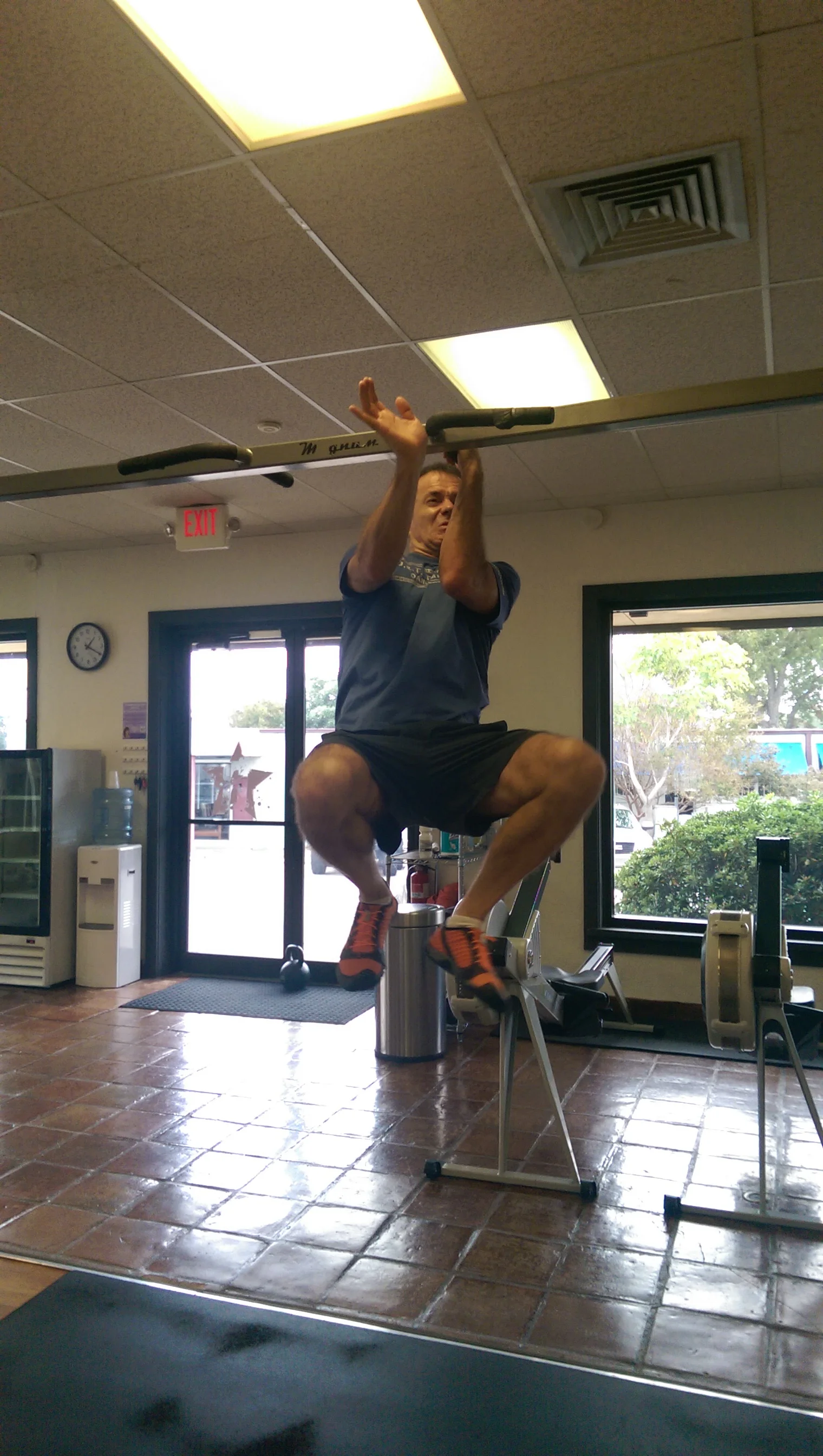 Maurice working on one-arm pull ups