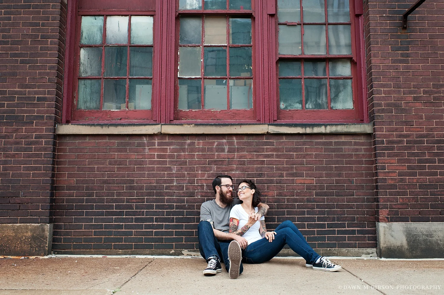 Carly + Phil rocked jeans, neutral t-shirts, and converse for their summer engagement session, allowing us to have a lot of fun in urban areas around Buffalo, NY for their summer engagement session.