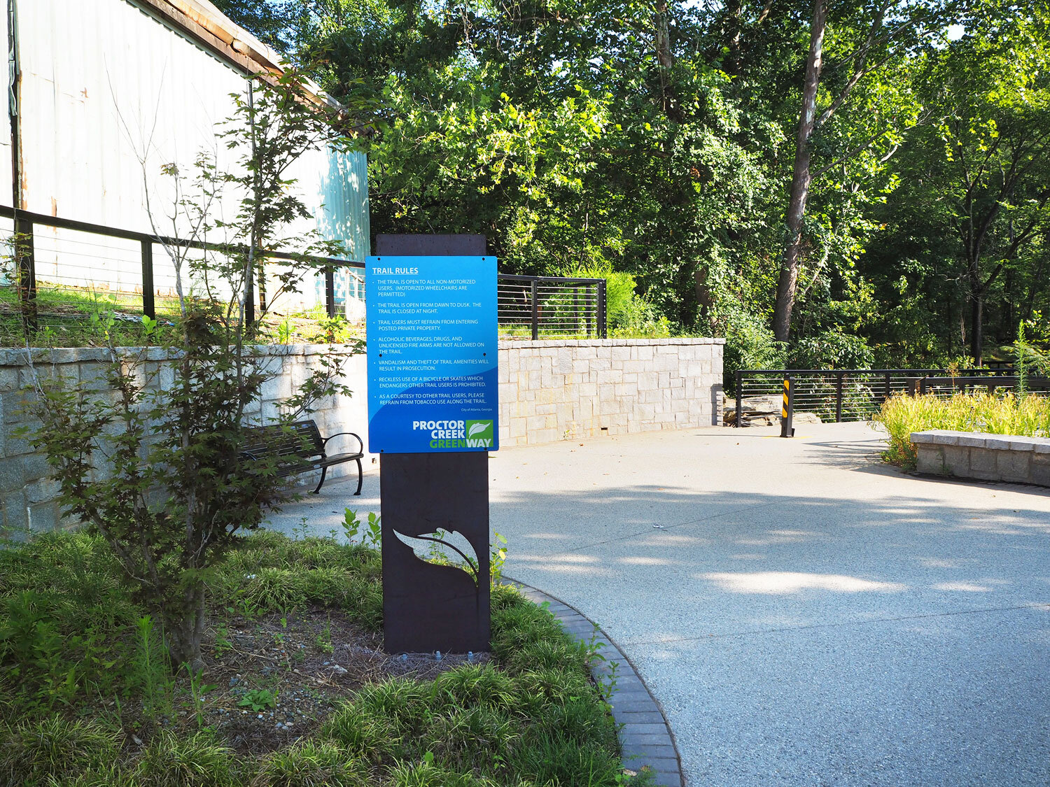  Plaza with a seat wall and kisok sign at southern end of the bridge 