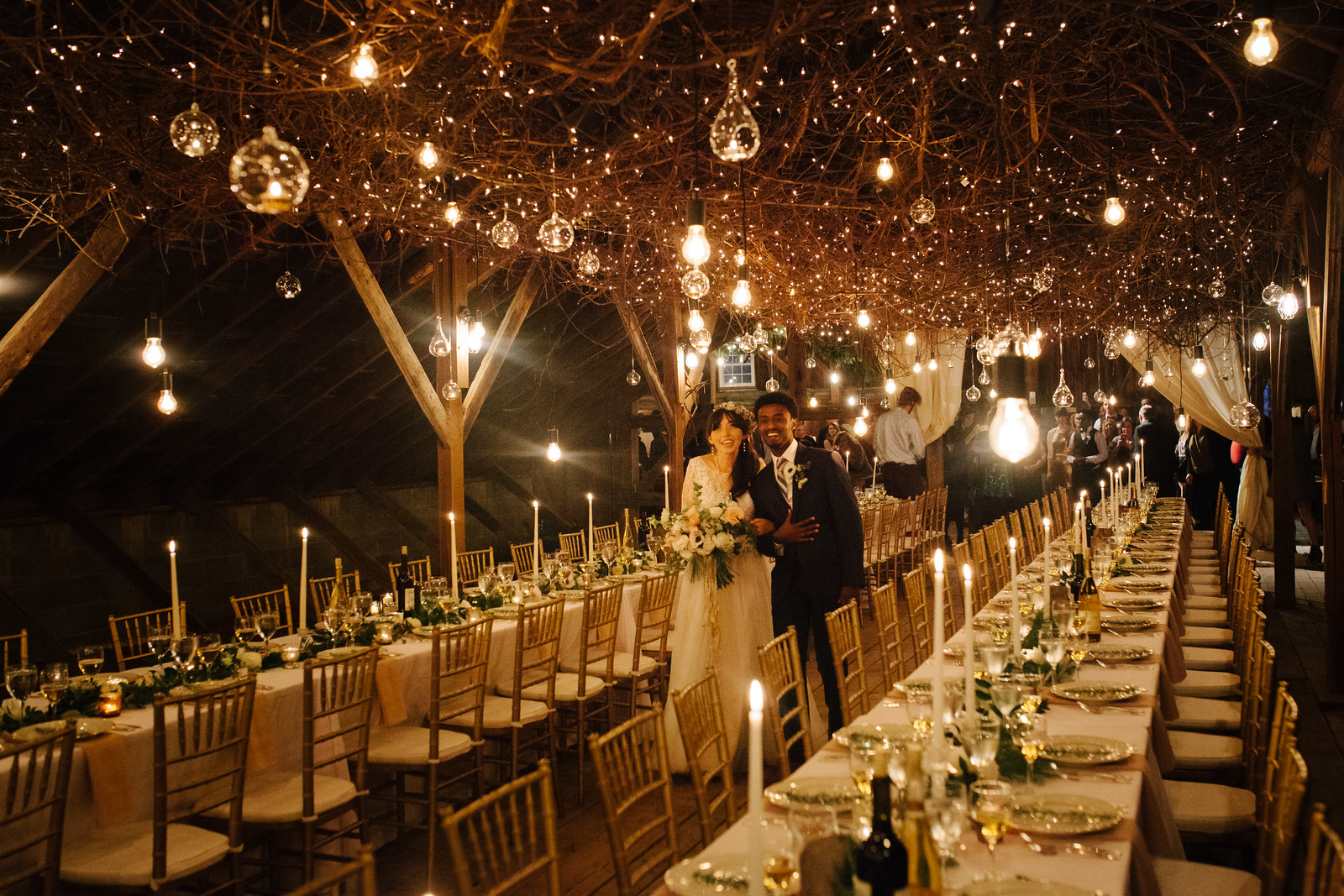 A bride and groom so happy looking at their barn reception
