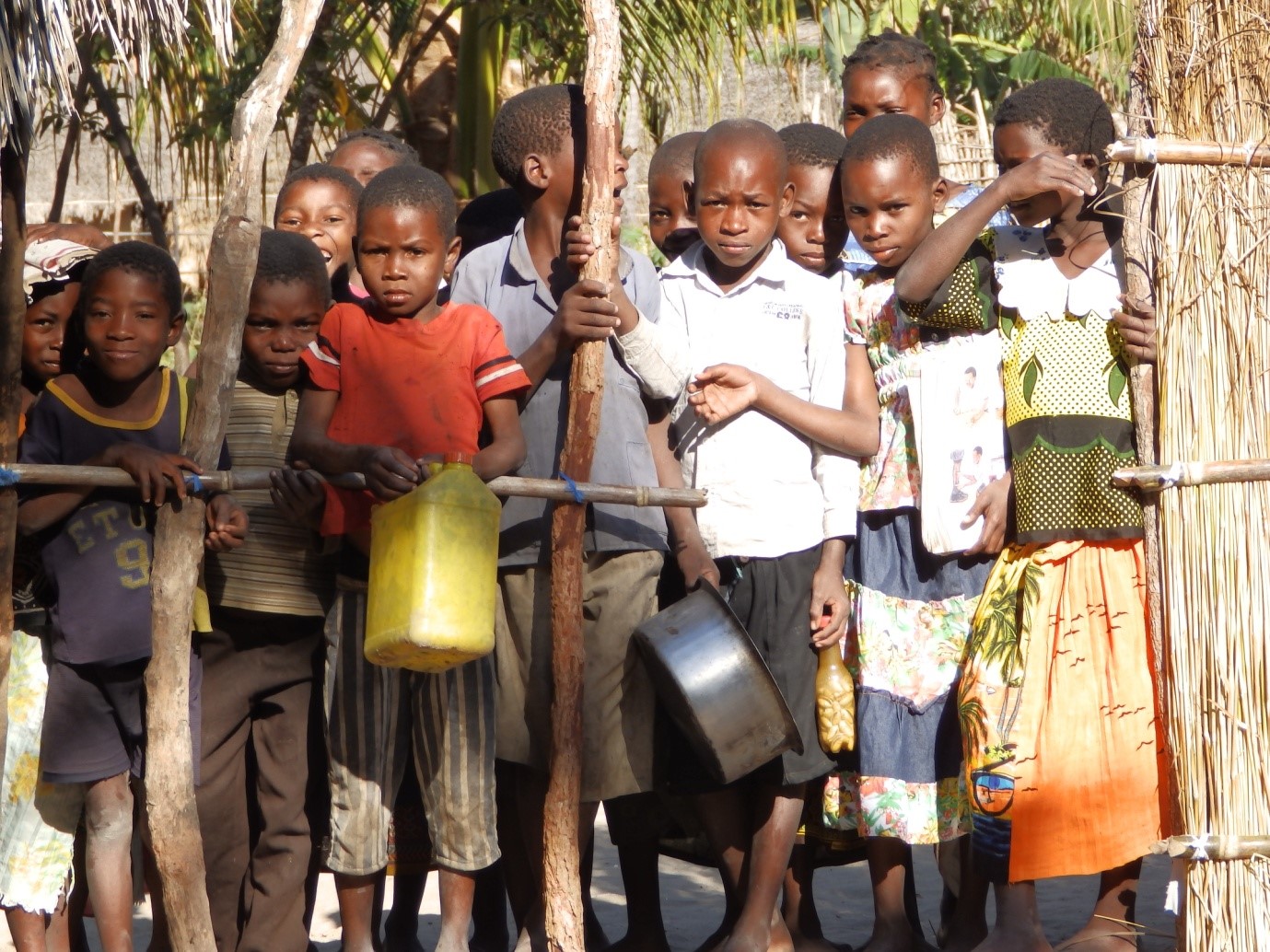 The kids watch through the fence, it was very well disciplined and controlled in this yard.