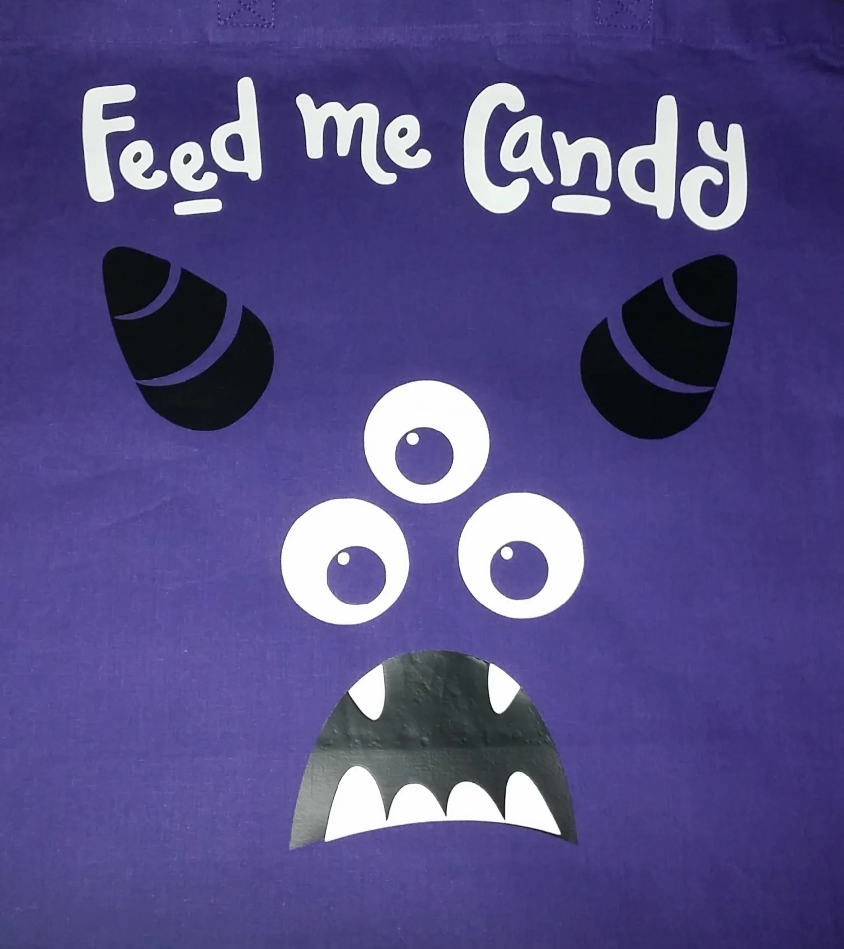 Text, eyes and teeth glow in the dark.