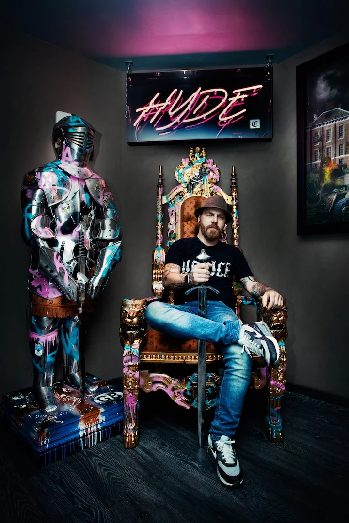 JJ Adams with his bespoke artworks at the HYDE Kensington, London.